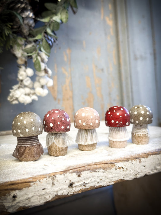 A wooden hand painted and trimmed Christmas village toadstool small button one