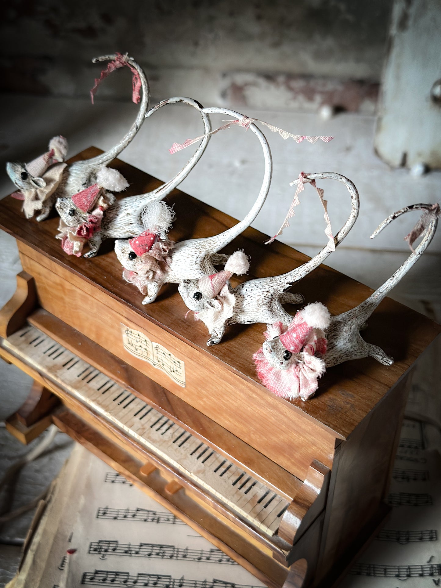 A cold painted brass “night before Christmas mouse” with a fabric ruffle and Christmas hat