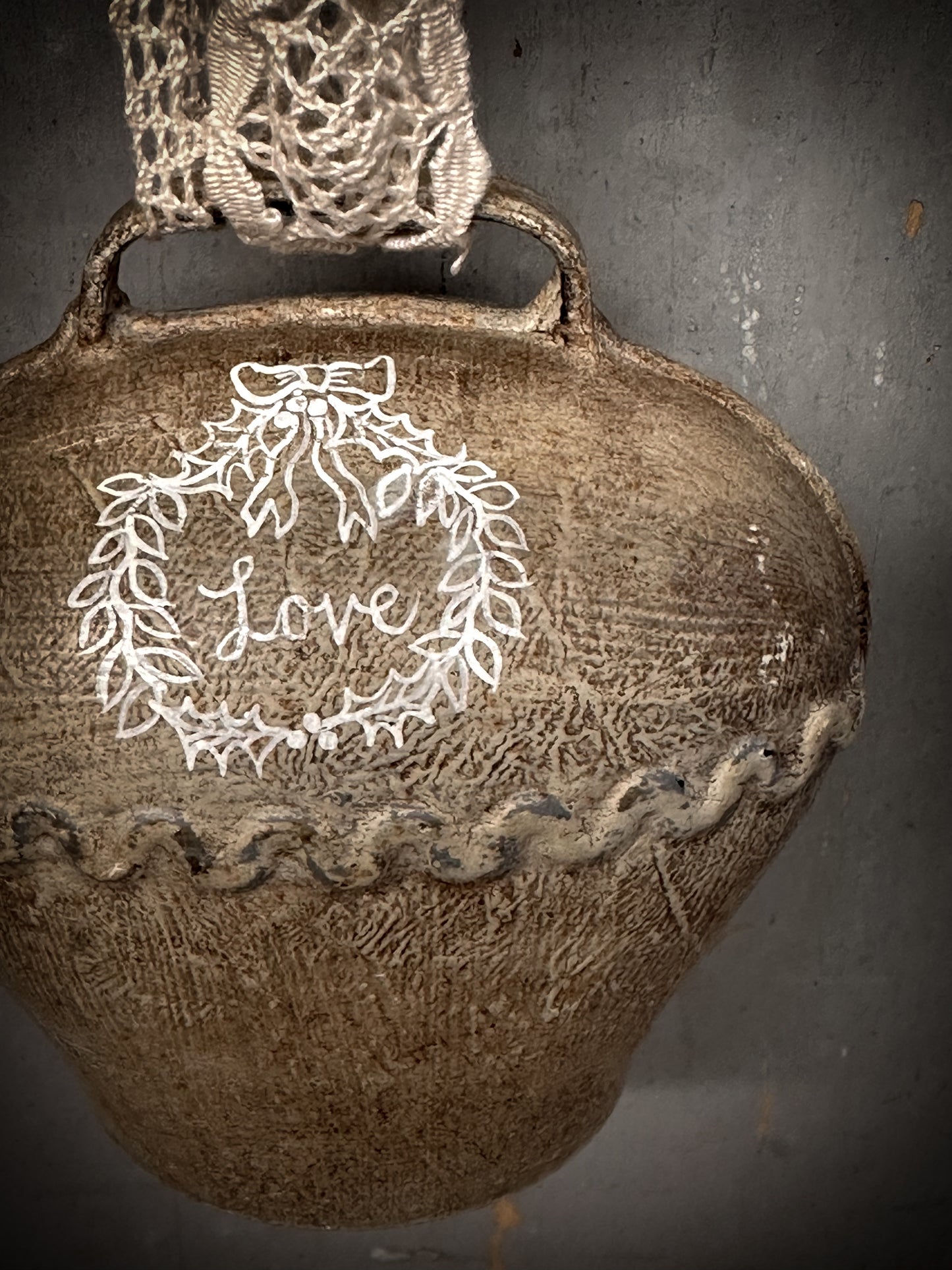 A Large Vintage Painted Cow Bell With a Hand Painted Quote