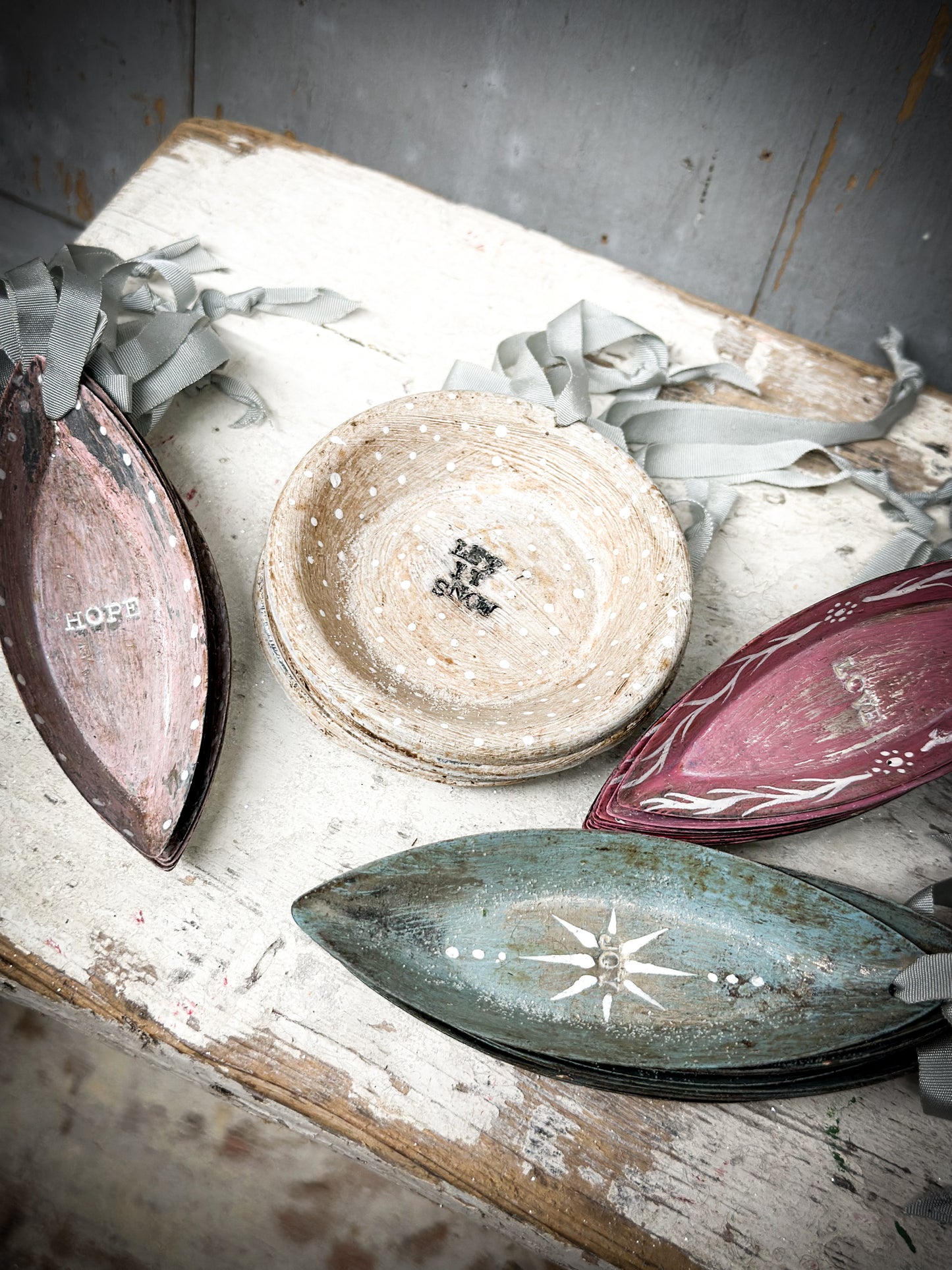 A Reworked French Patisserie Tin Christmas Decoration Stamped and Painted “Let It Snow”