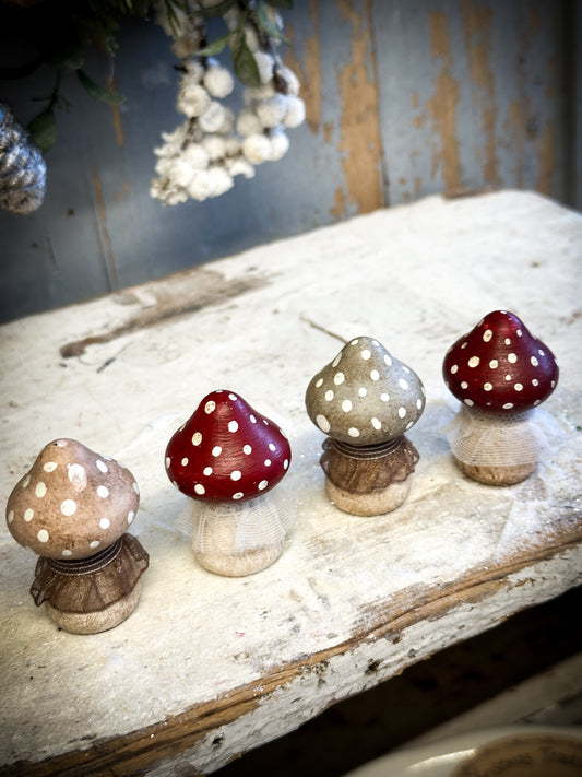 A wooden hand painted and trimmed Christmas village toadstool large pointy one