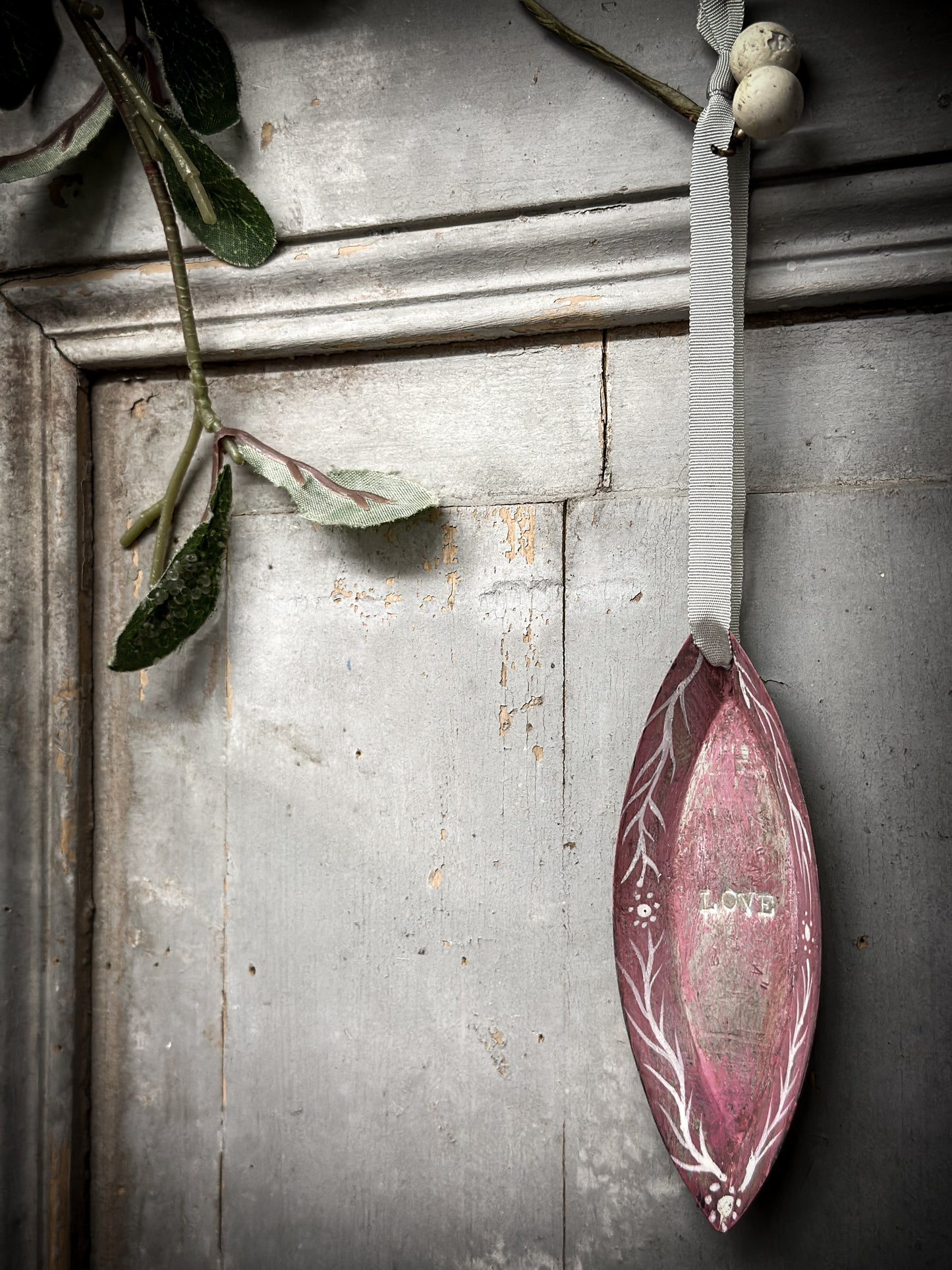 A Reworked French Patisserie Tin Christmas Decoration Stamped and Painted “love”