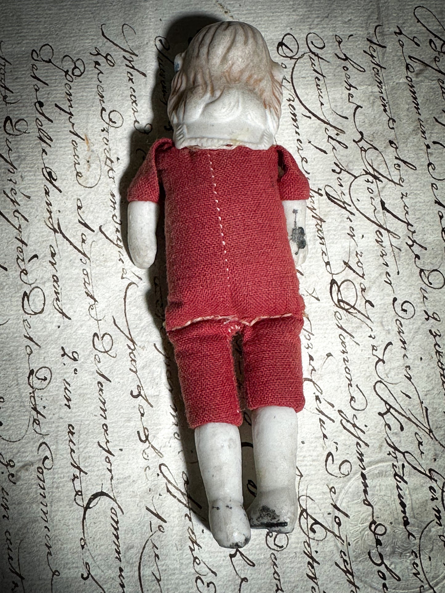 A vintage bisque head and shoulder doll