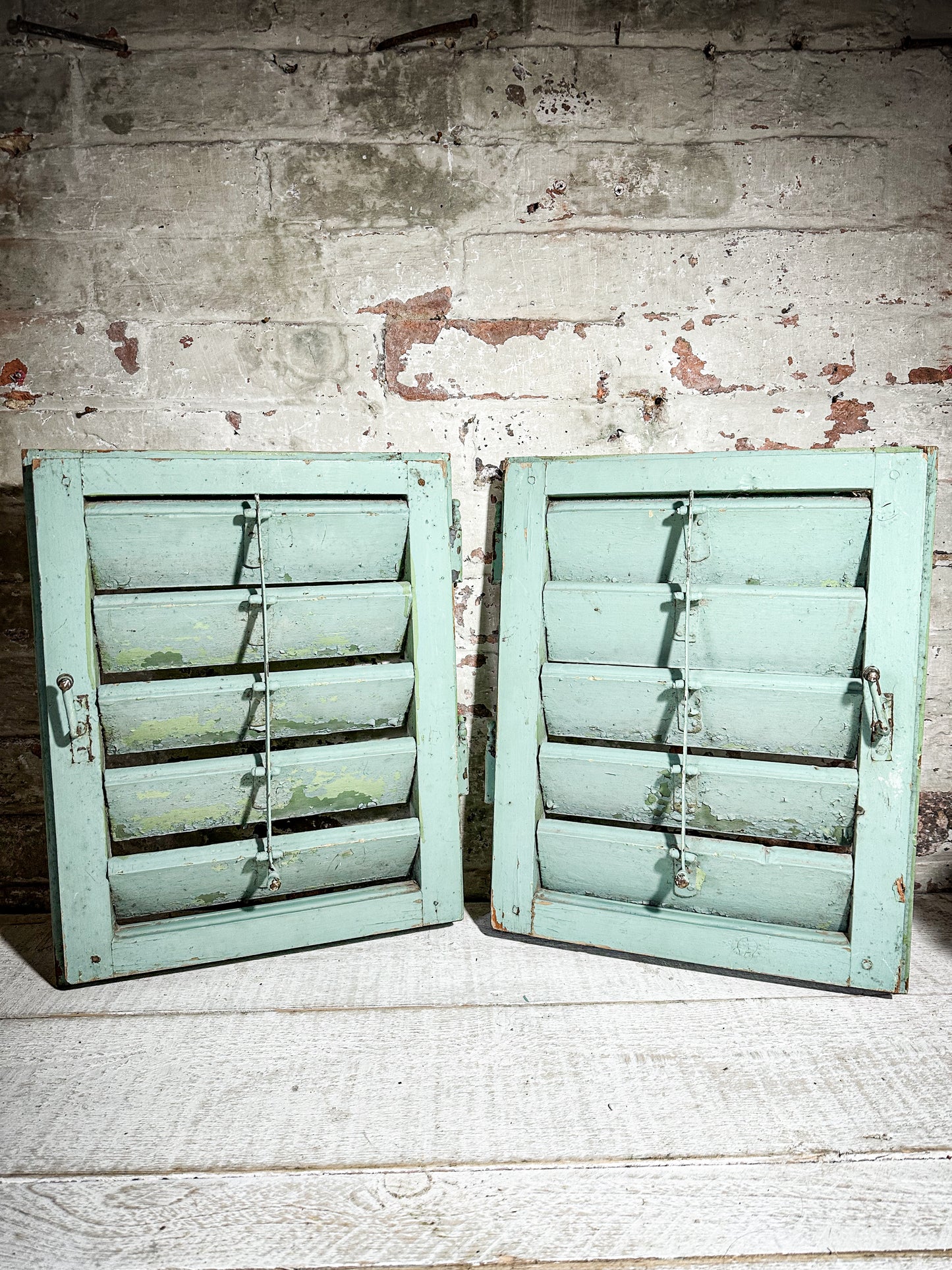 A Pair of French Green Chippy Painted Shutters