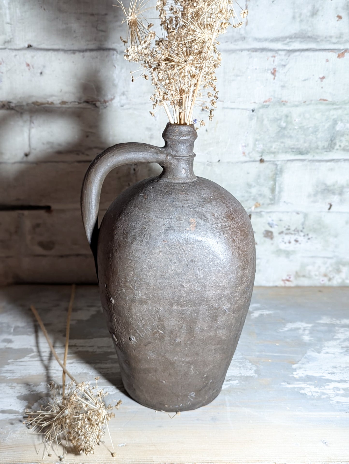 A stunning large Primitive French Antique Black Pottery oil bottle