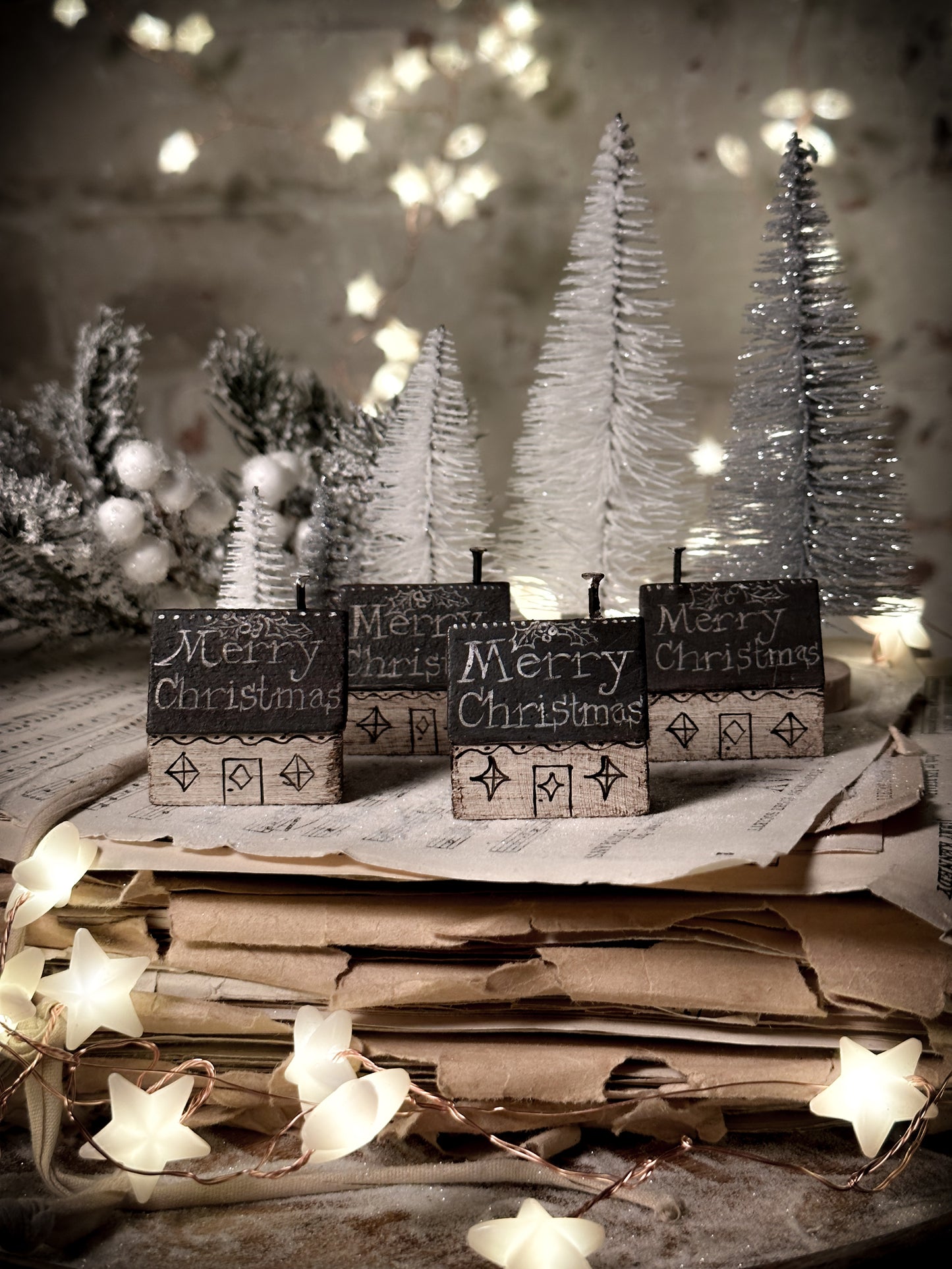 A pretty vintage German Erzgebirge Putz wooden village house painted with a Christmas quote