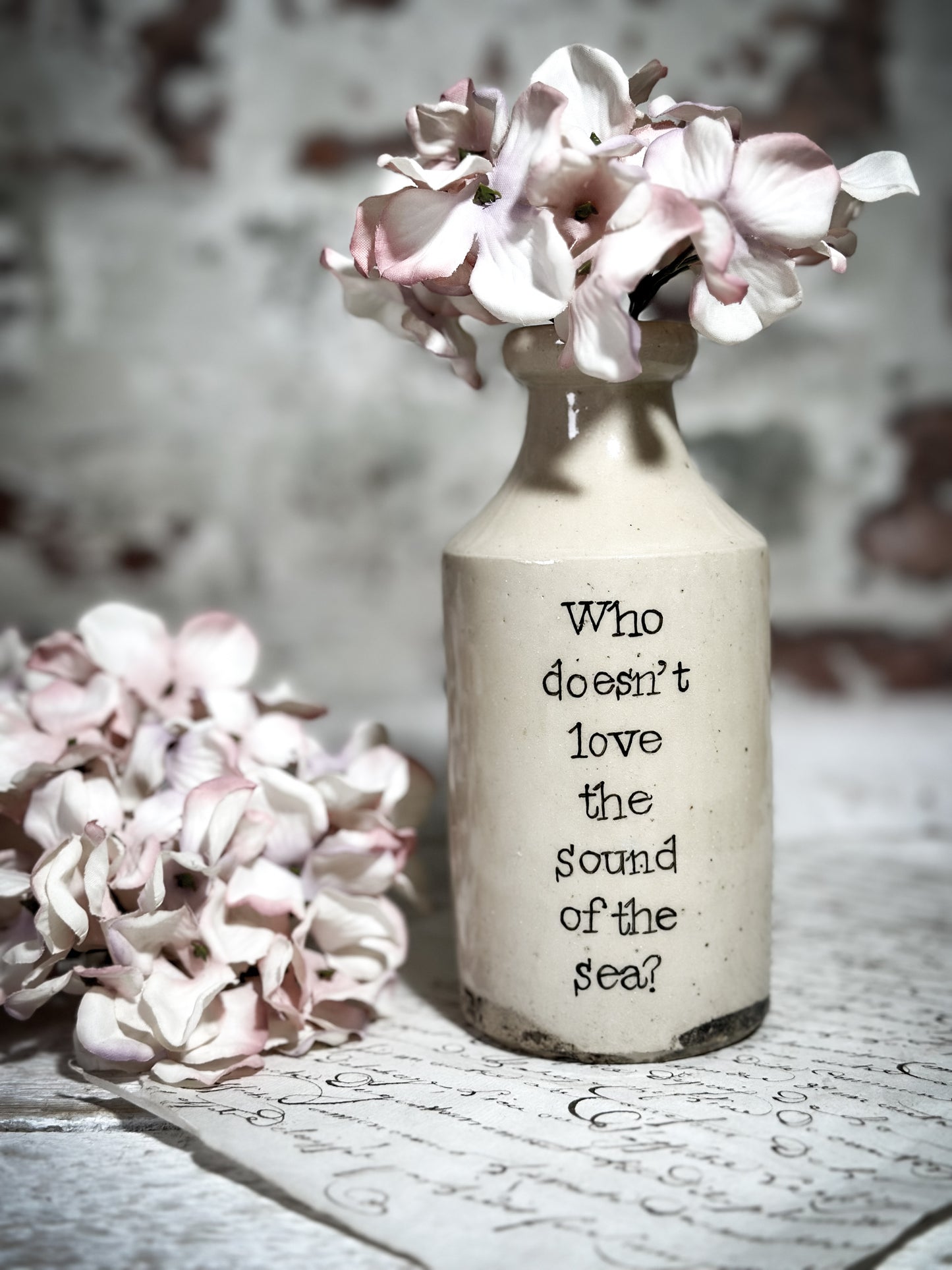 An Antique Pottery Bottle with a Hand Painted Inspirational Quote