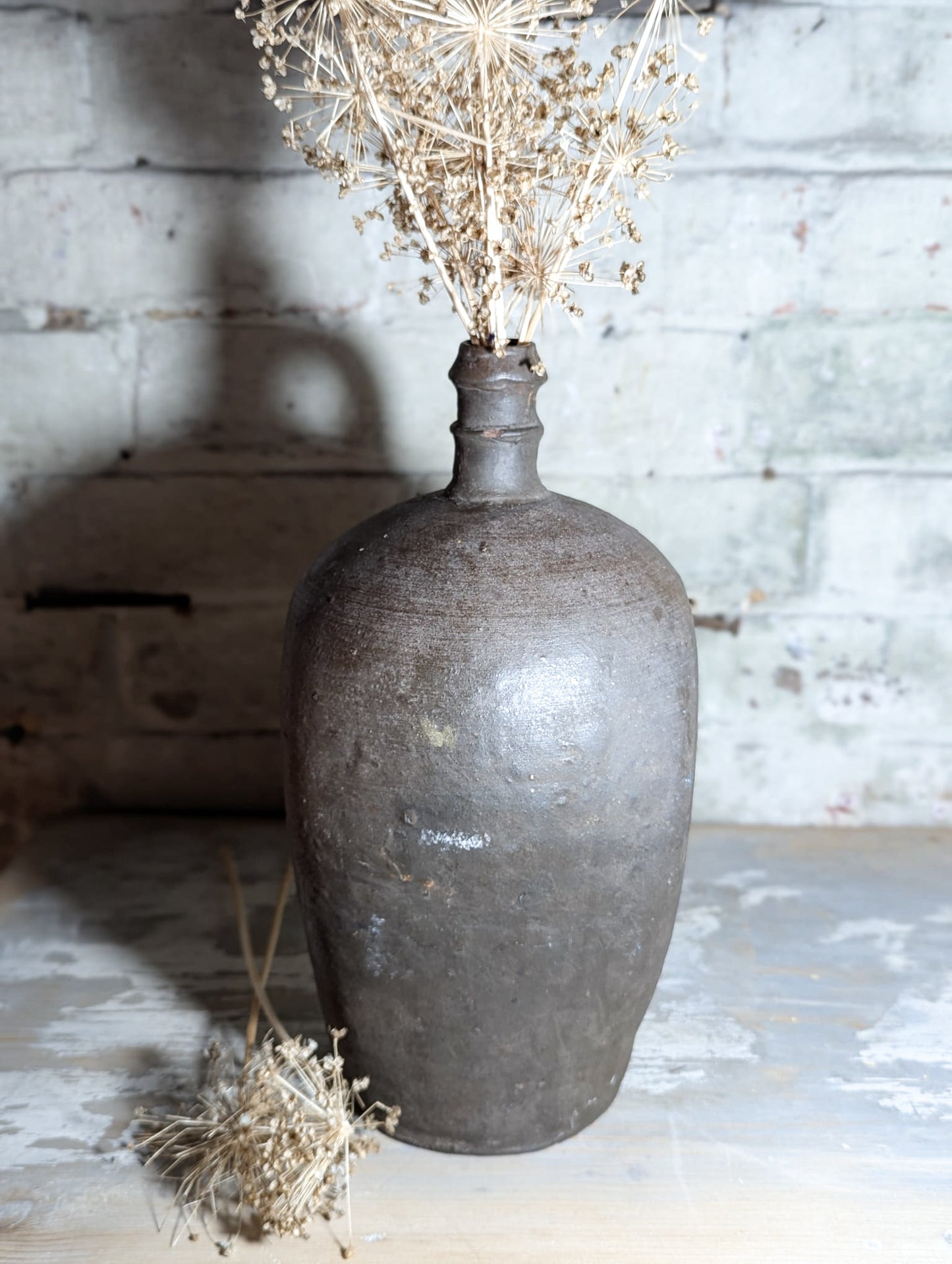 A stunning large Primitive French Antique Black Pottery oil bottle