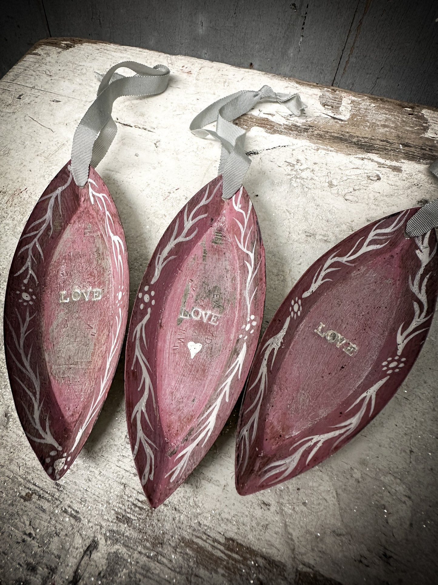 A Reworked French Patisserie Tin Christmas Decoration Stamped and Painted “love”