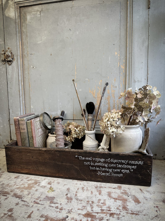 A Vintage Wooden Crate With Hand Painted Quote