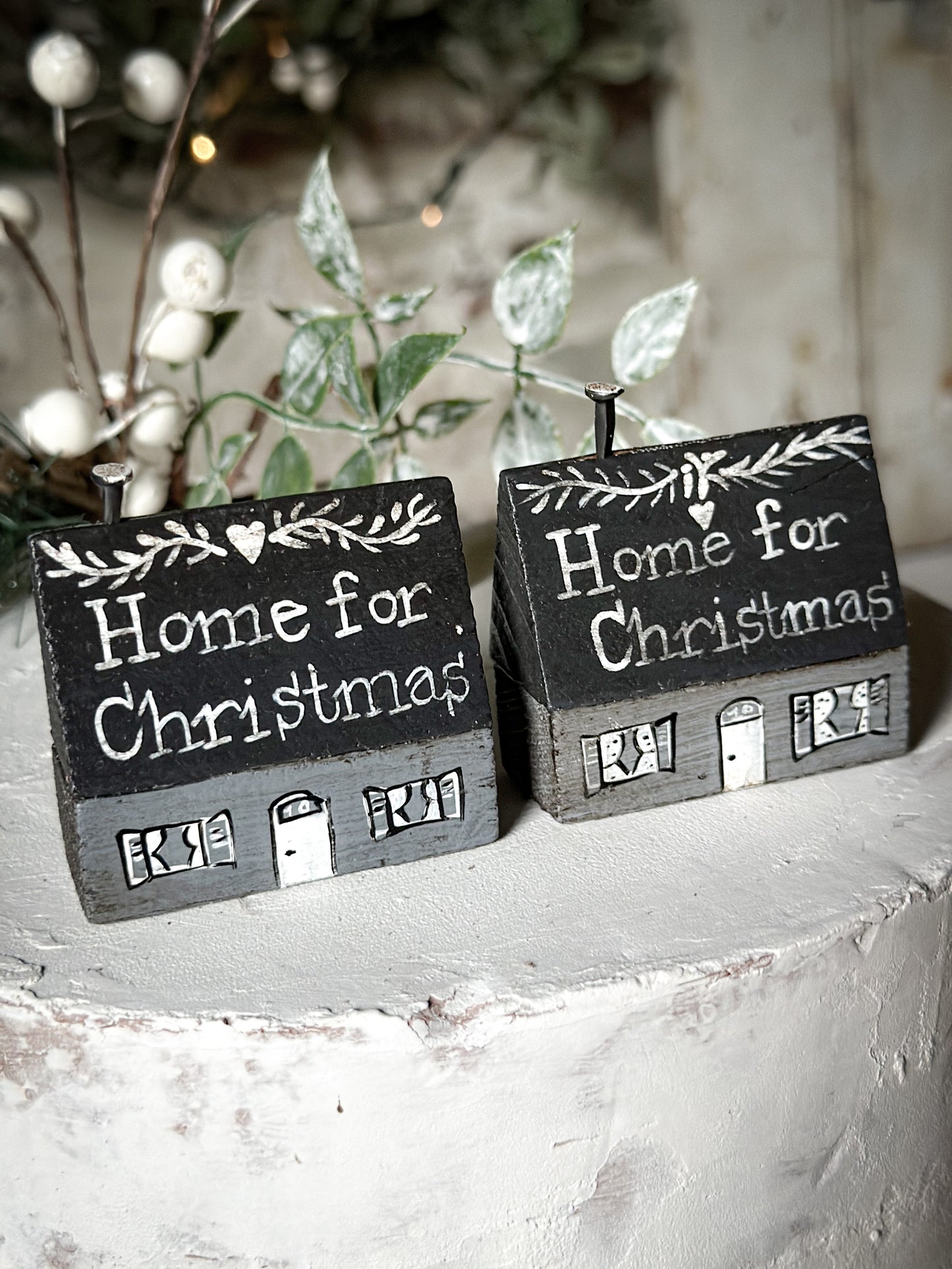 A pretty vintage German Erzgebirge Putz wooden village house painted with a Christmas quote