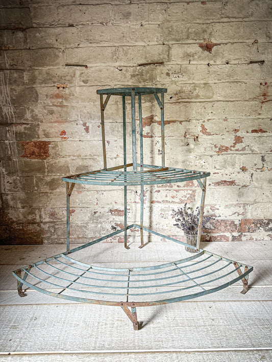 A vintage French metal etagere or plant stand