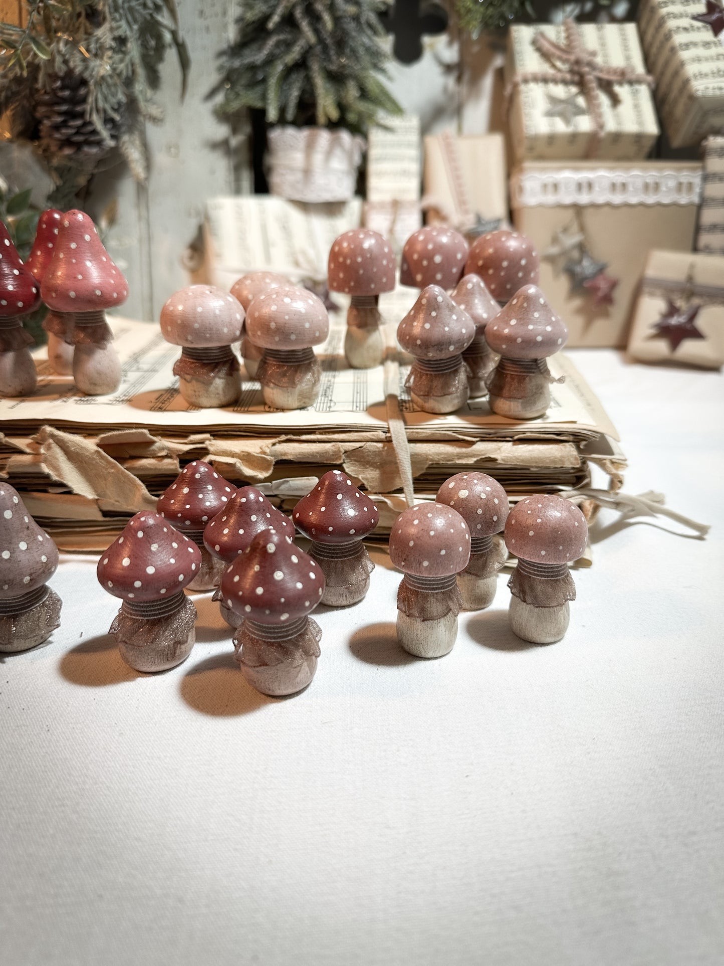 A wooden hand painted and trimmed Christmas village toadstool