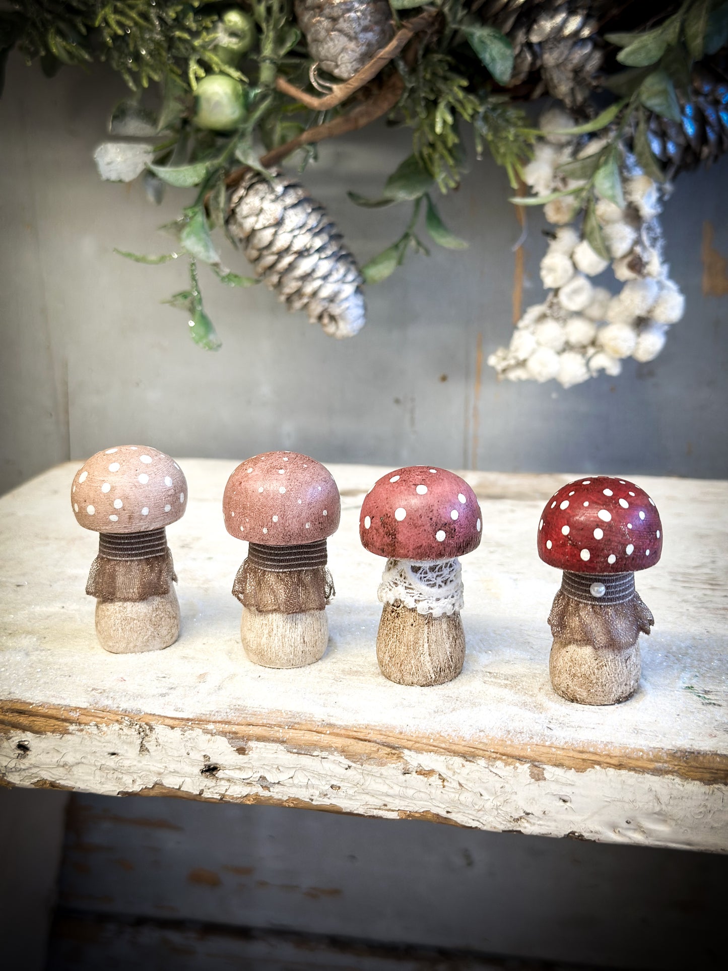 A wooden hand painted and trimmed Christmas village toadstool medium button one