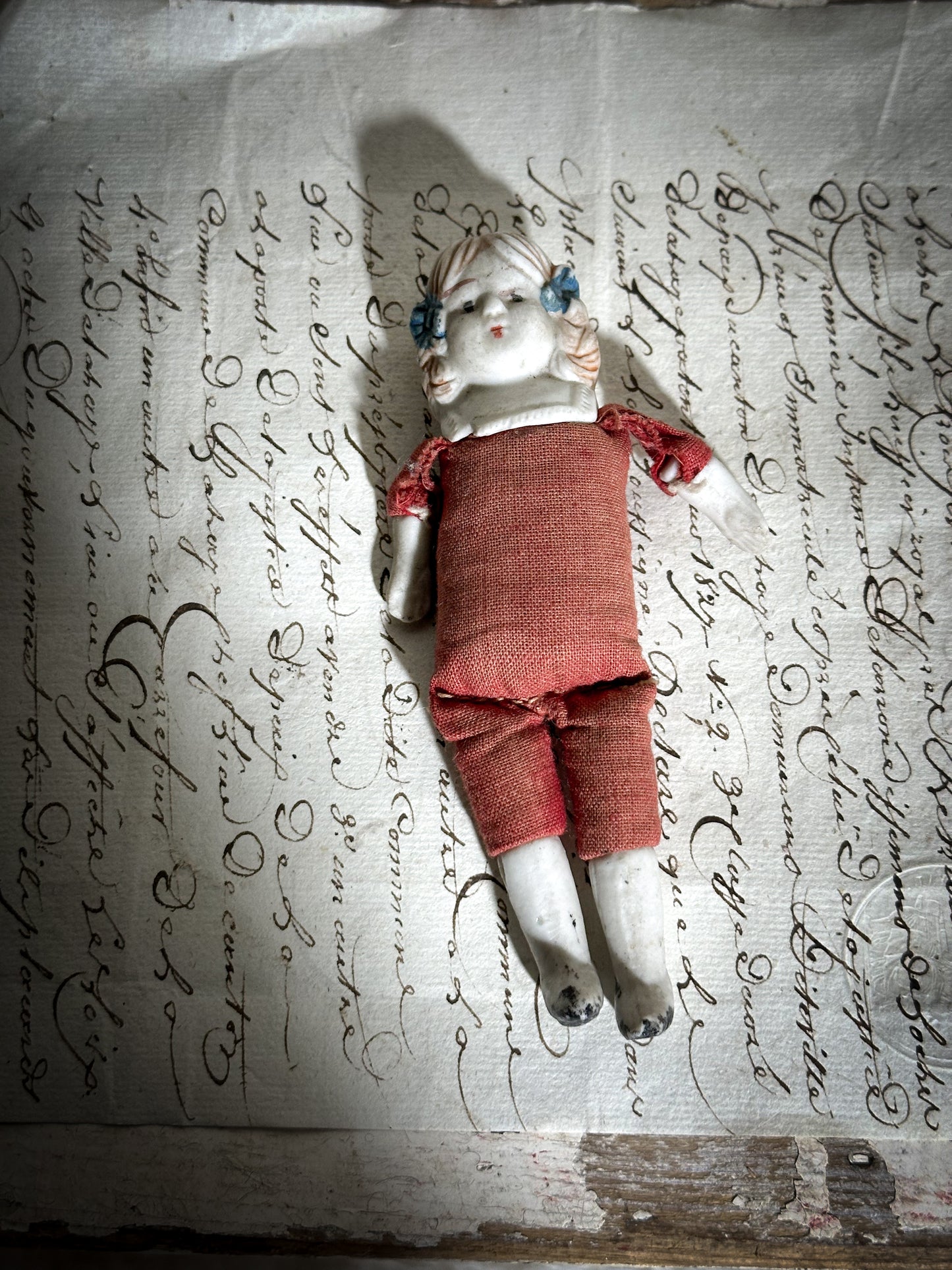 A vintage bisque head and shoulder doll