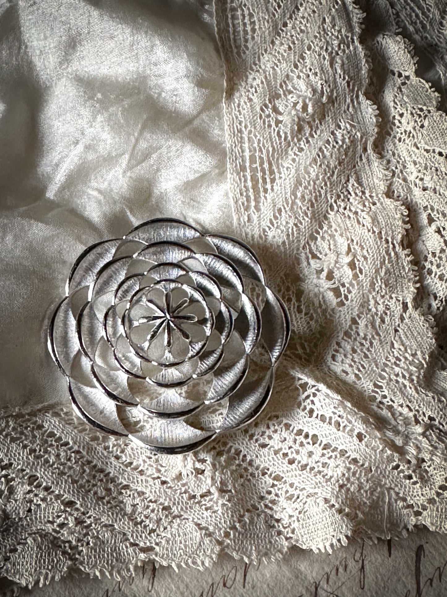 A glorious vintage Sara Coventry brushed white metal flower brooch signed