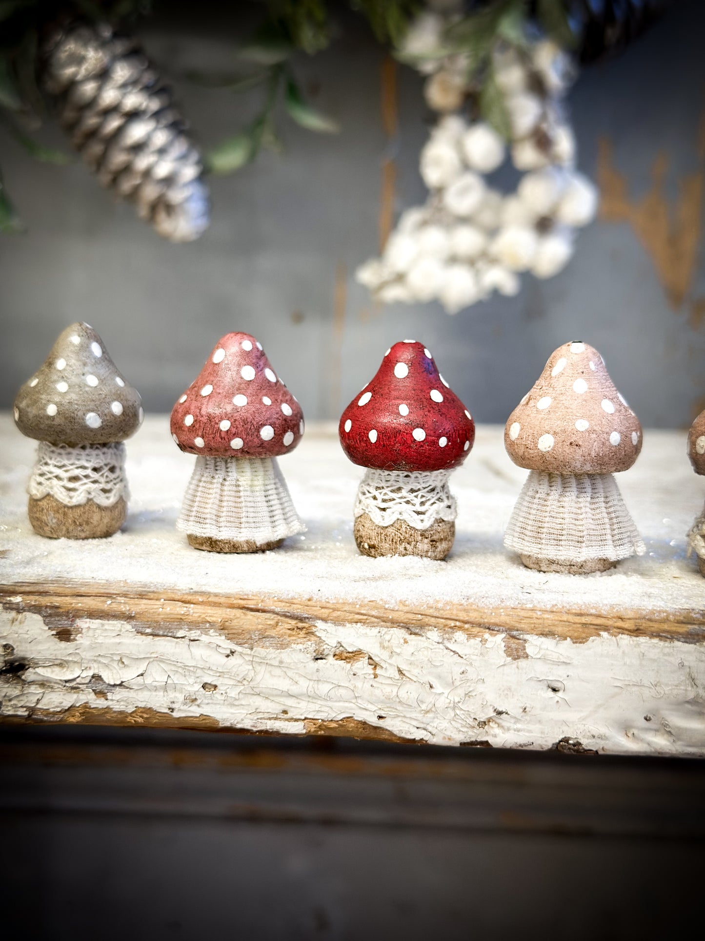 A wooden hand painted and trimmed Christmas village toadstool small pointy one