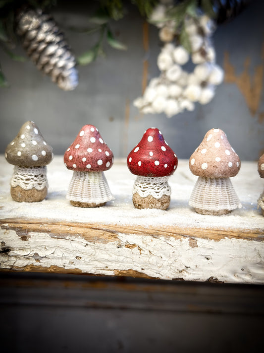 A wooden hand painted and trimmed Christmas village toadstool small pointy one