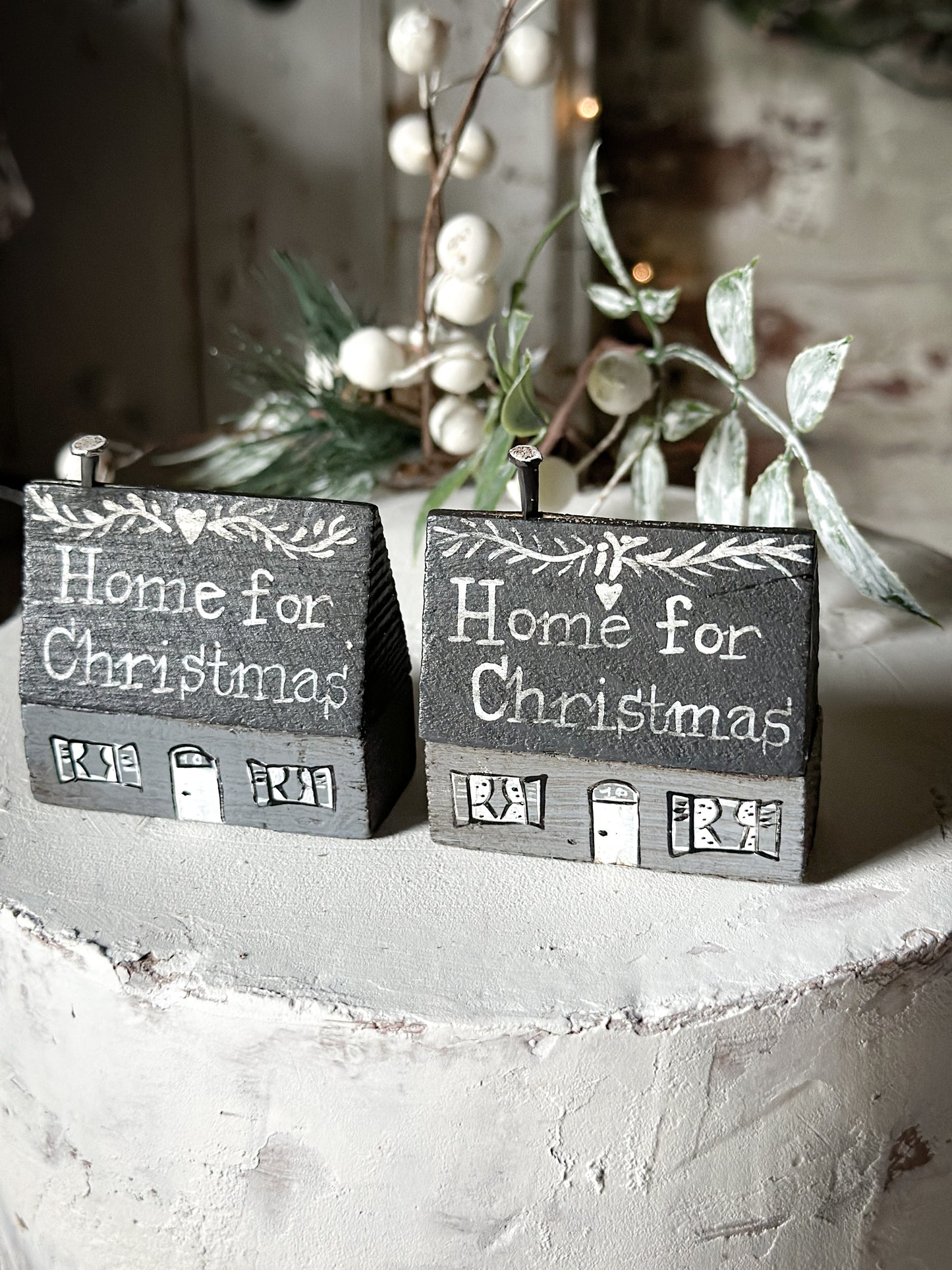 A pretty vintage German Erzgebirge Putz wooden village house painted with a Christmas quote