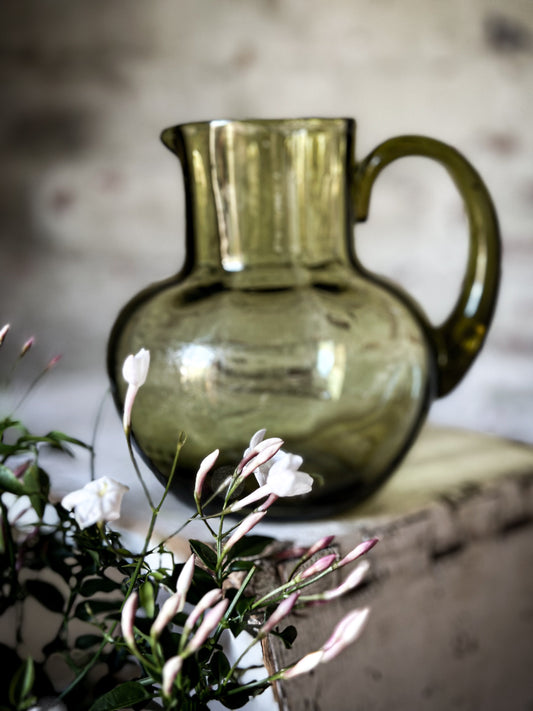 A beautiful antique Olive glass hand blown water jug