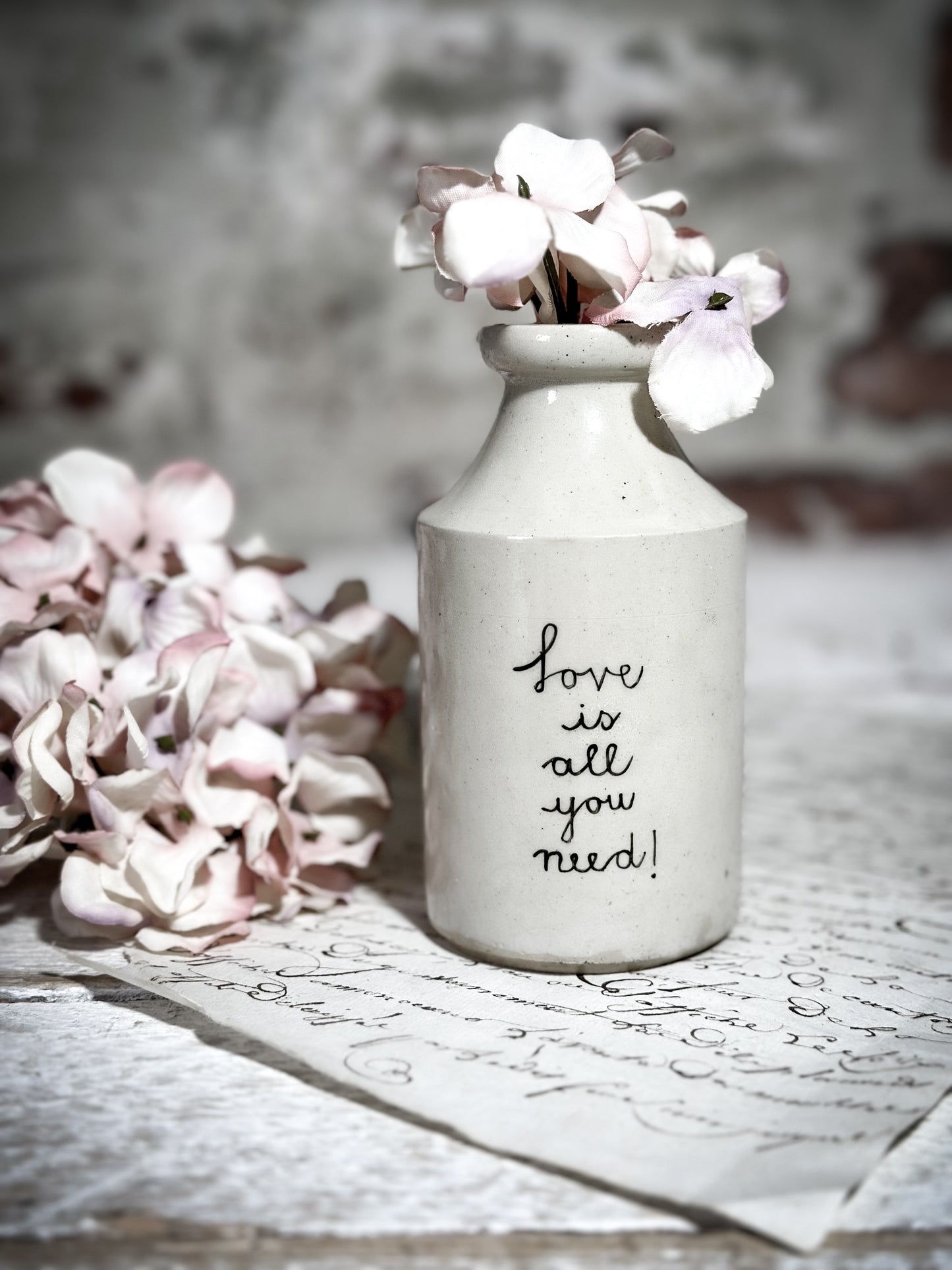 An Antique Bottle with a Hand Painted Inspirational Quote