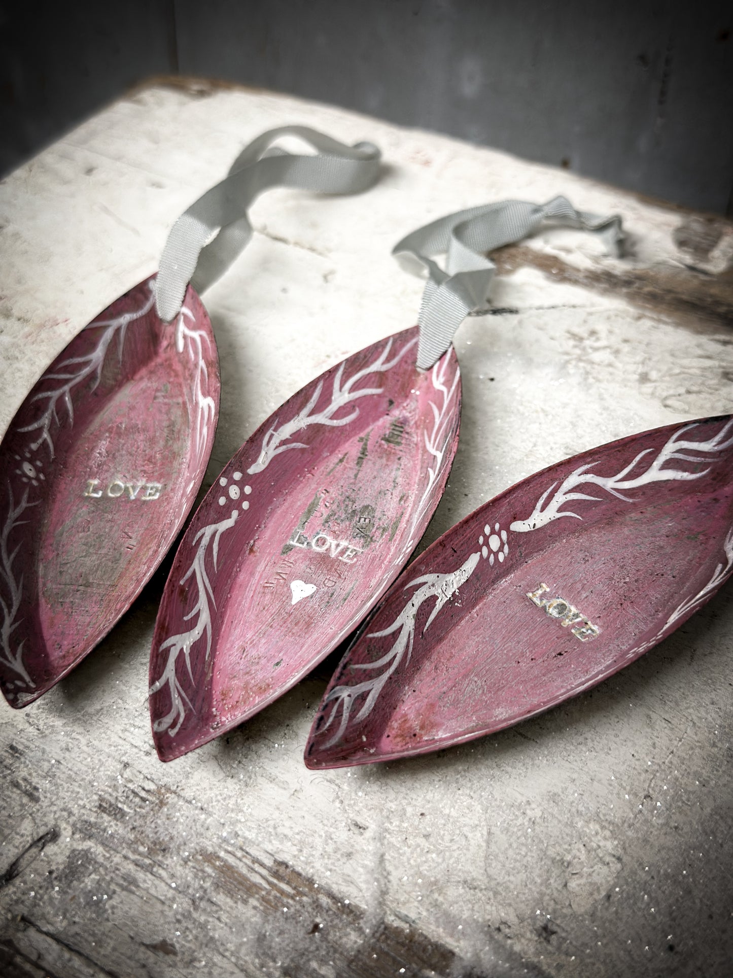 A Reworked French Patisserie Tin Christmas Decoration Stamped and Painted “love”