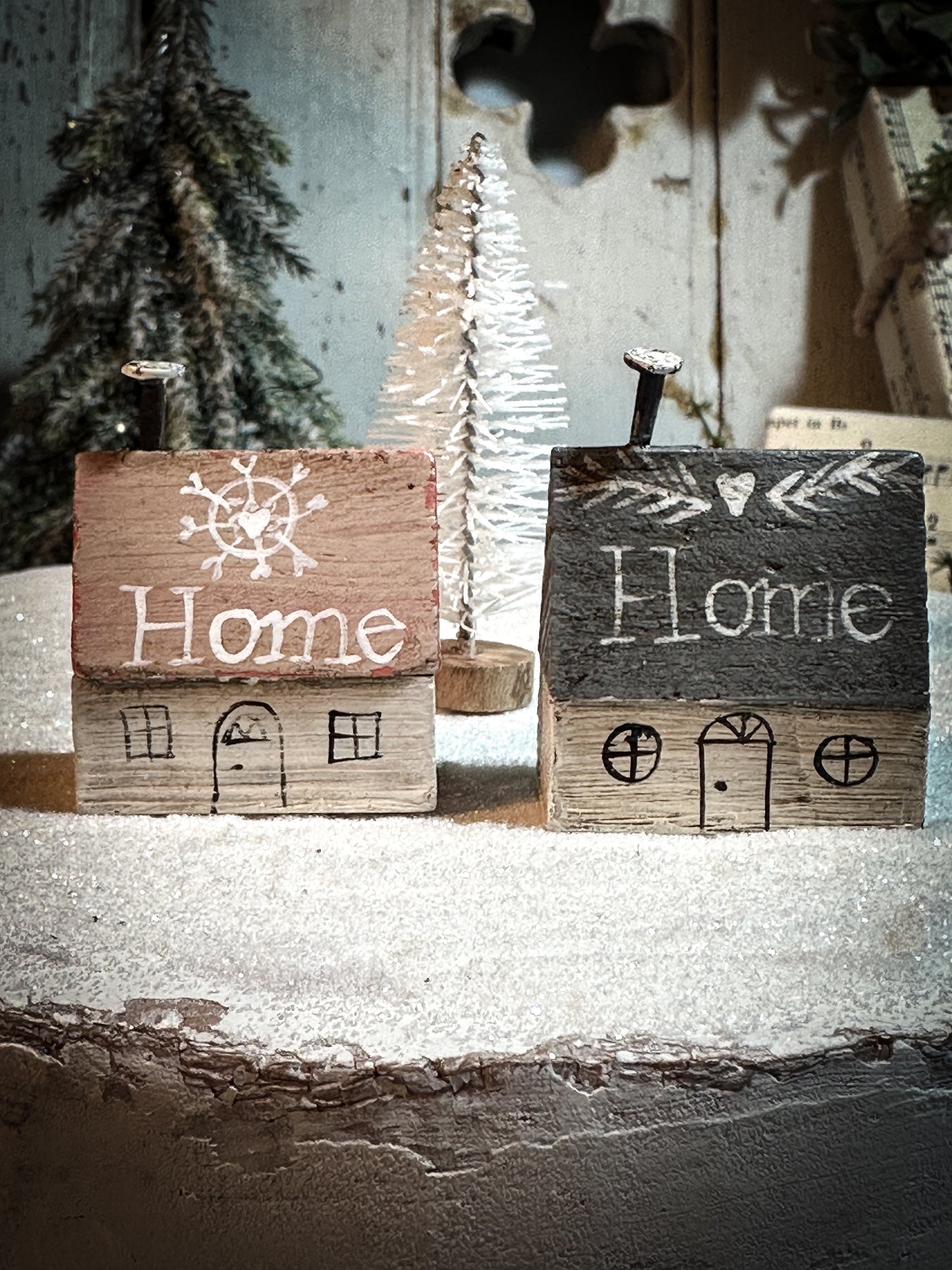 A pretty vintage German Erzgebirge Putz wooden village house painted with a Christmas quote