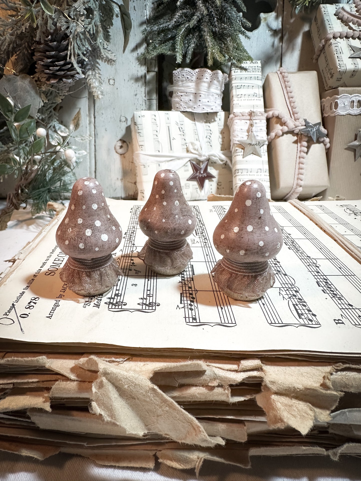 A wooden hand painted and trimmed Christmas village toadstool