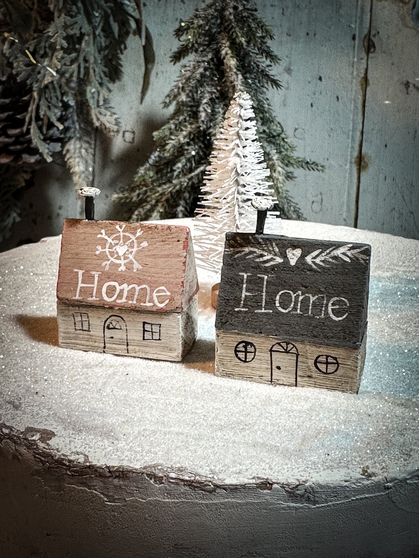 A pretty vintage German Erzgebirge Putz wooden village house painted with a Christmas quote