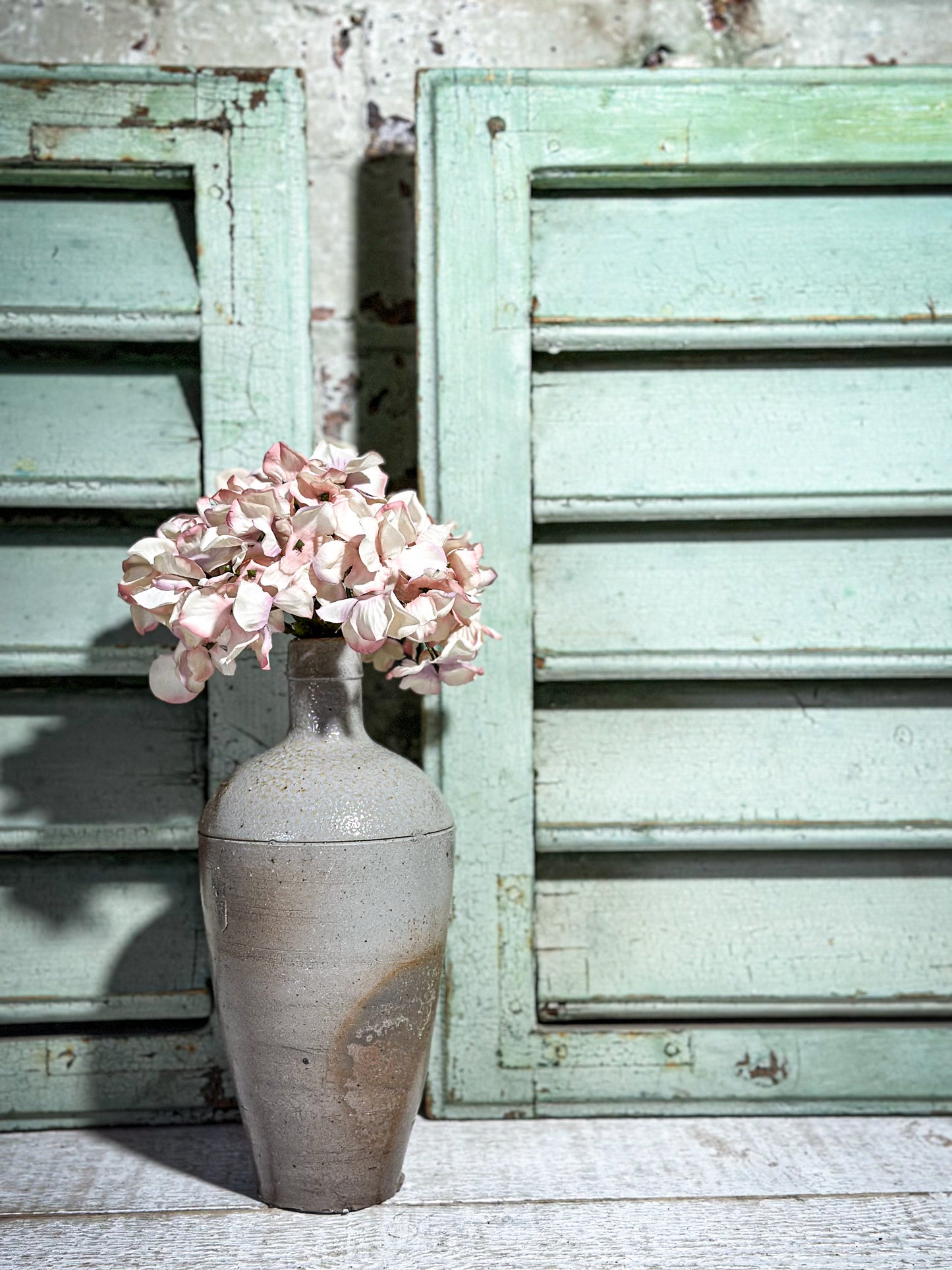 A Pair of French Green Chippy Painted Shutters