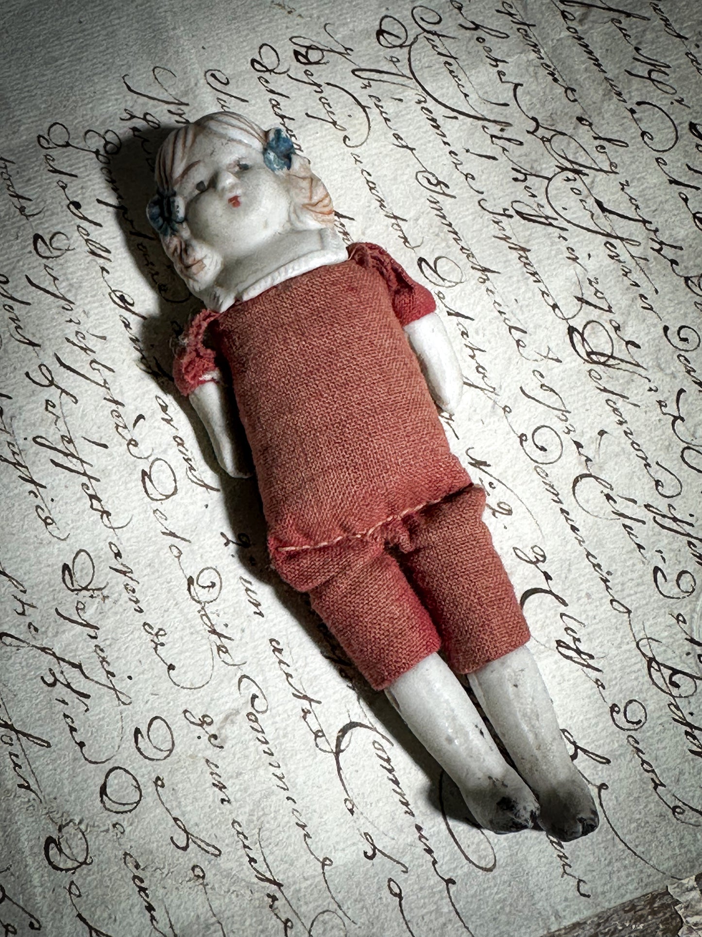 A vintage bisque head and shoulder doll