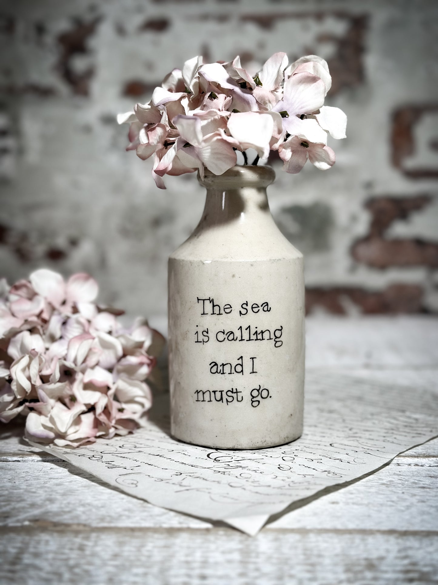 An Antique Pottery Bottle with a Hand Painted Inspirational Quote