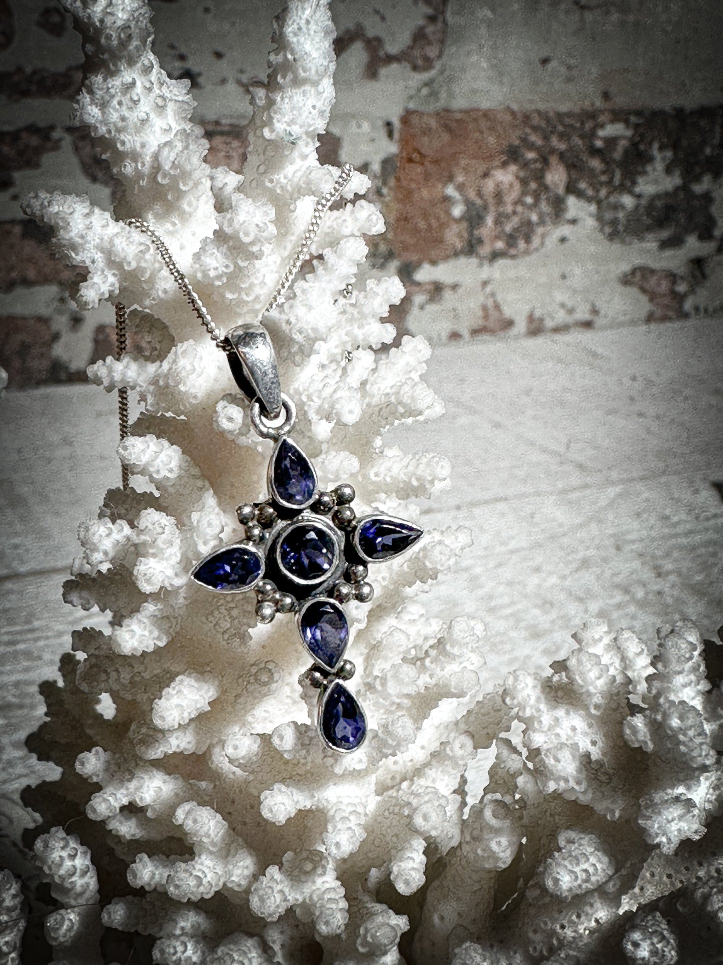 A vintage silver and Tanzanite crucifix