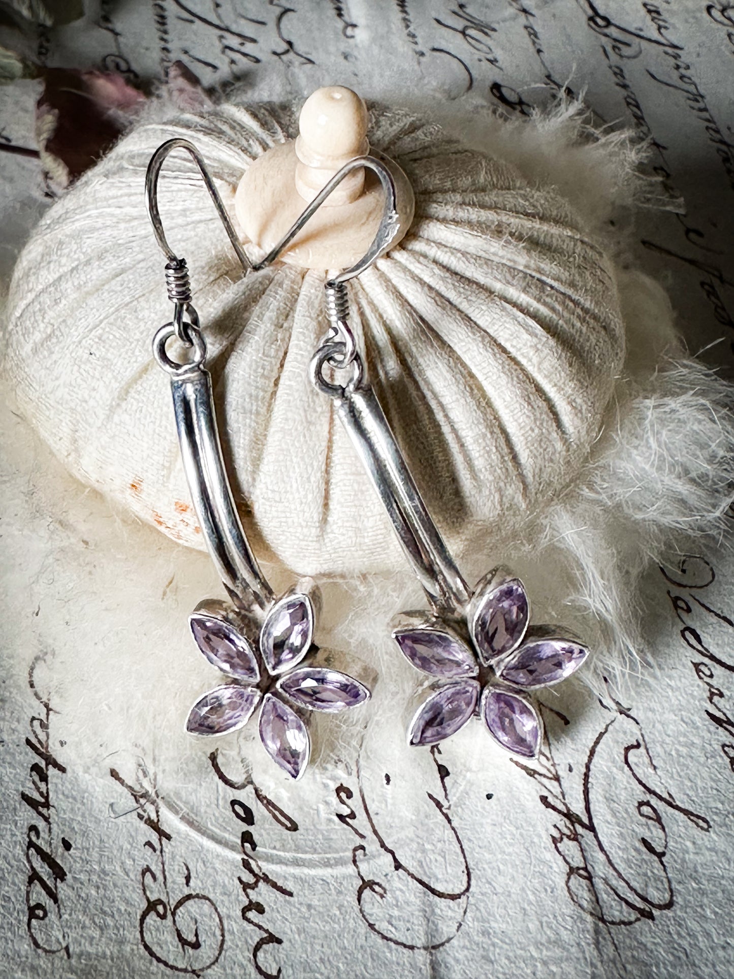 A pair of vintage silver amethyst flower drop earrings