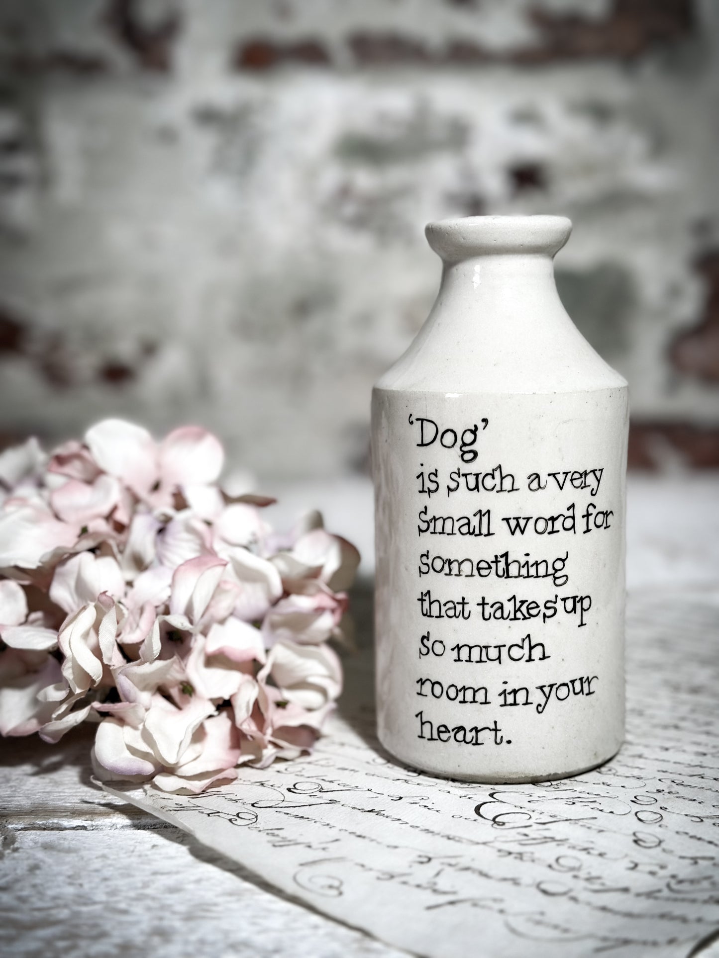 An Antique Pottery Bottle with a Hand Painted Inspirational Quote