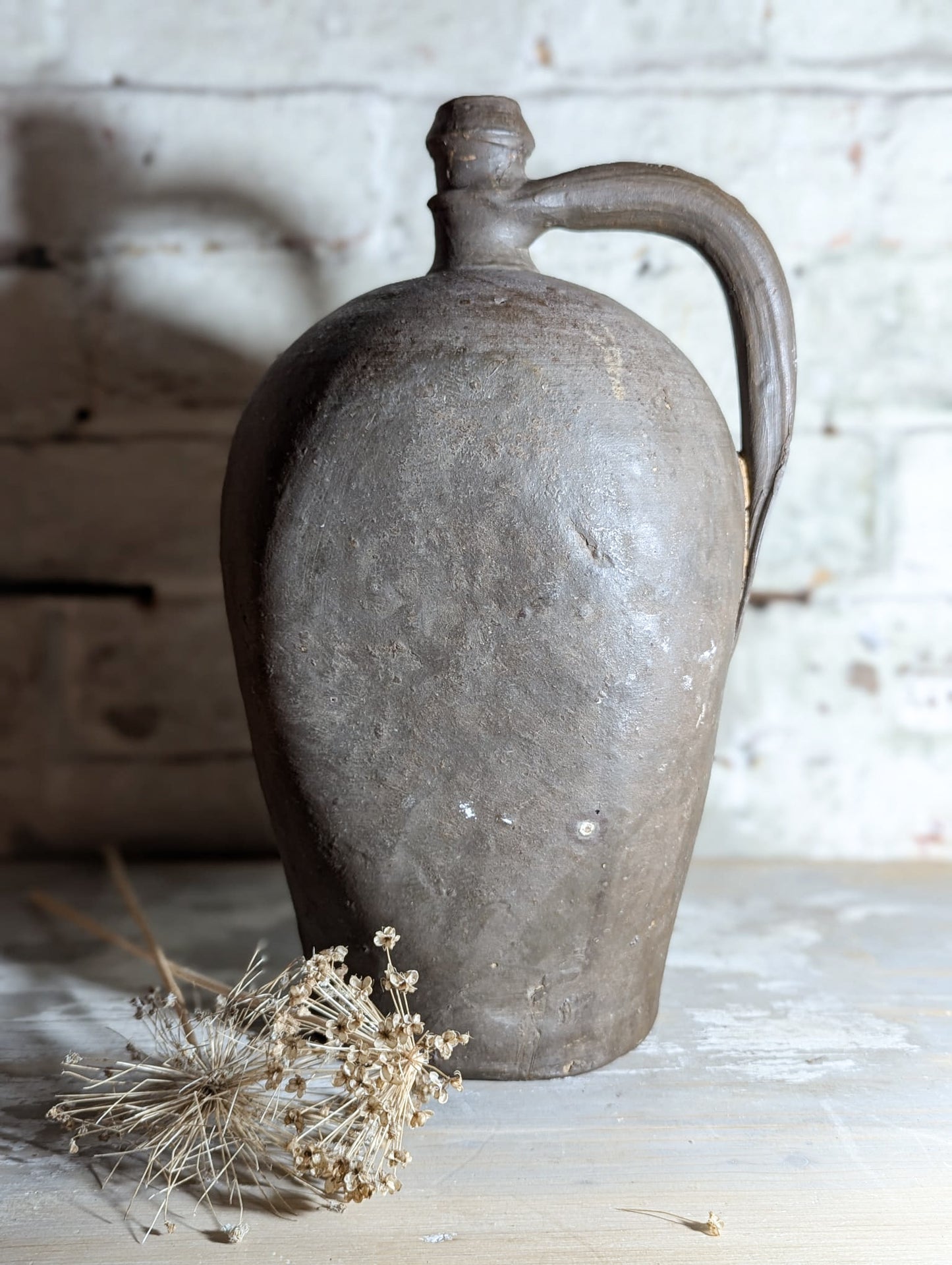 A stunning large Primitive French Antique Black Pottery oil bottle