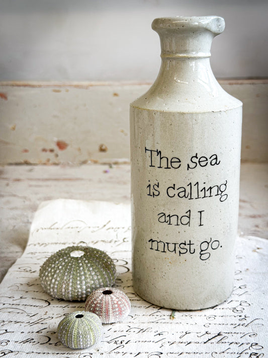 A Victorian unearthed short stoneware pottery bottle with a hand painted quote