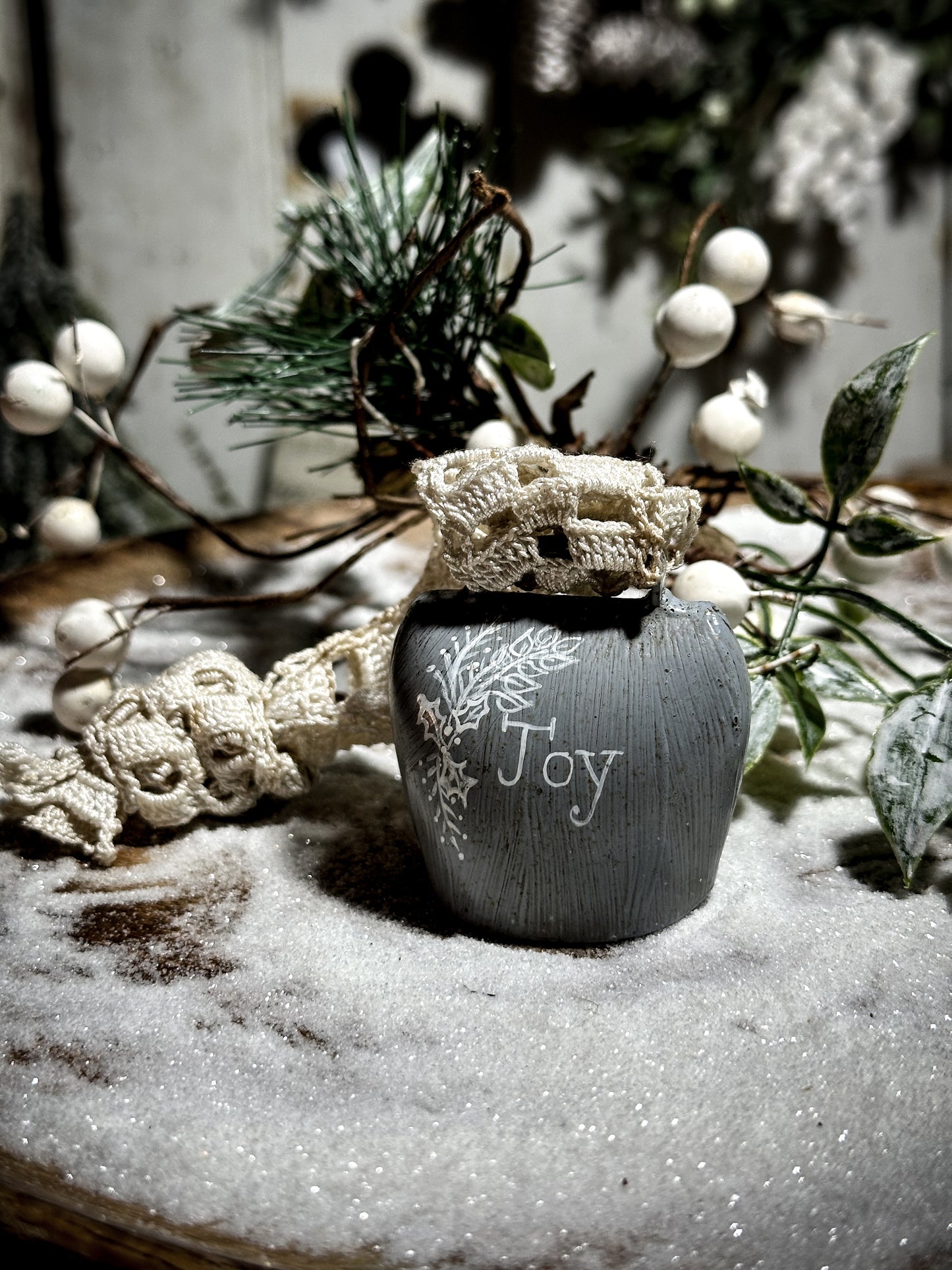 A vintage painted cow bell with a hand painted quote