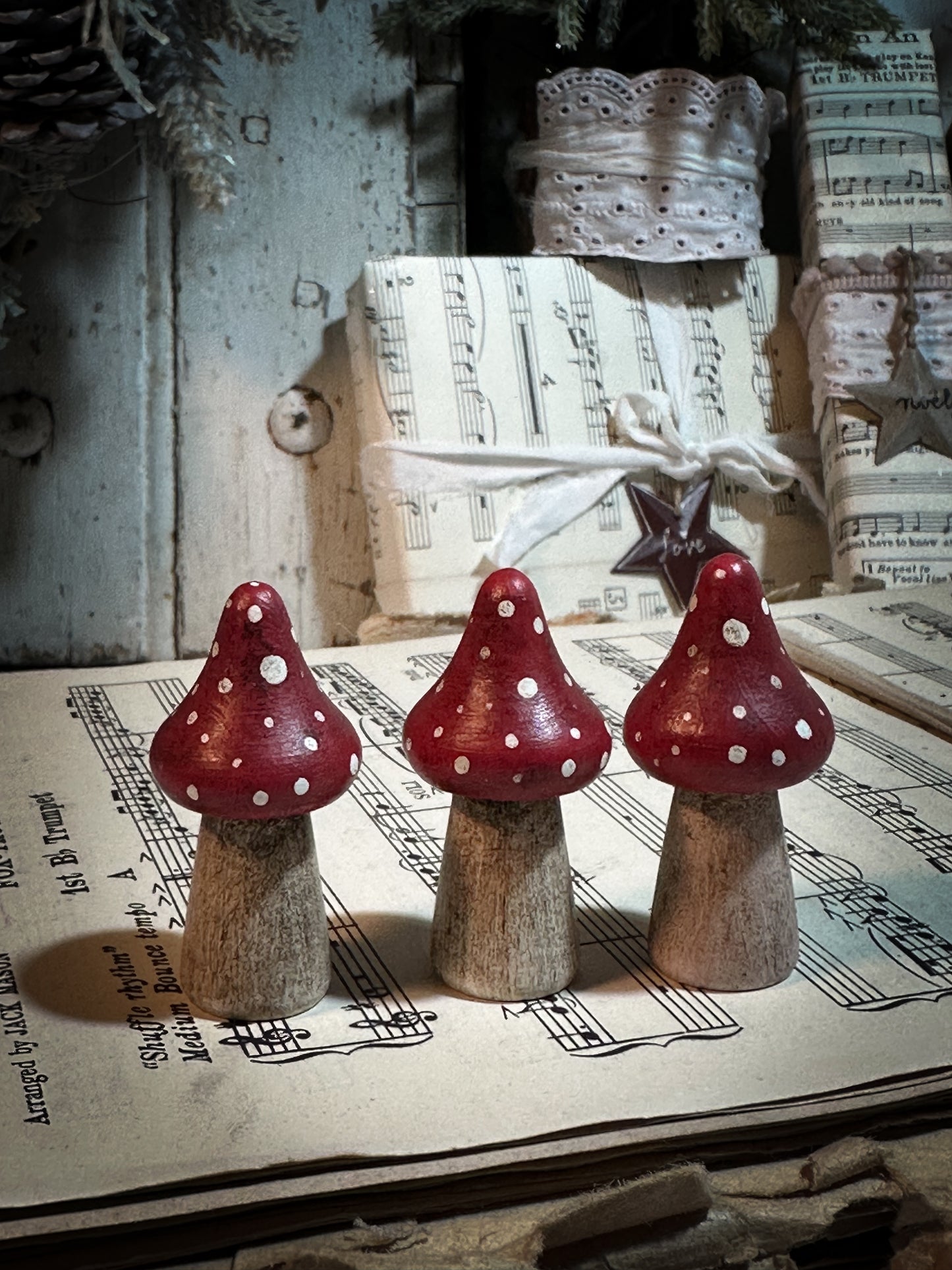 A wooden hand painted Christmas village toadstool