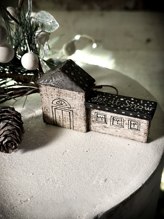 A pretty vintage German Erzgebirge Putz wooden village house painted with a Christmas quote