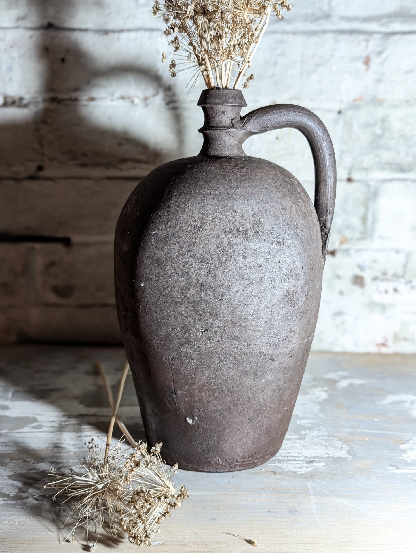 A stunning large Primitive French Antique Black Pottery oil bottle