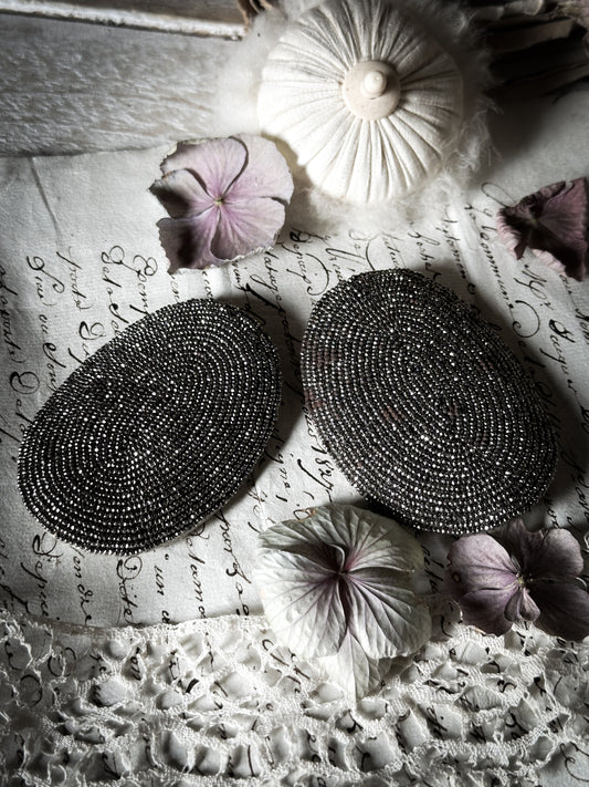 A pair of Victorian cut steel oval shoe buckles