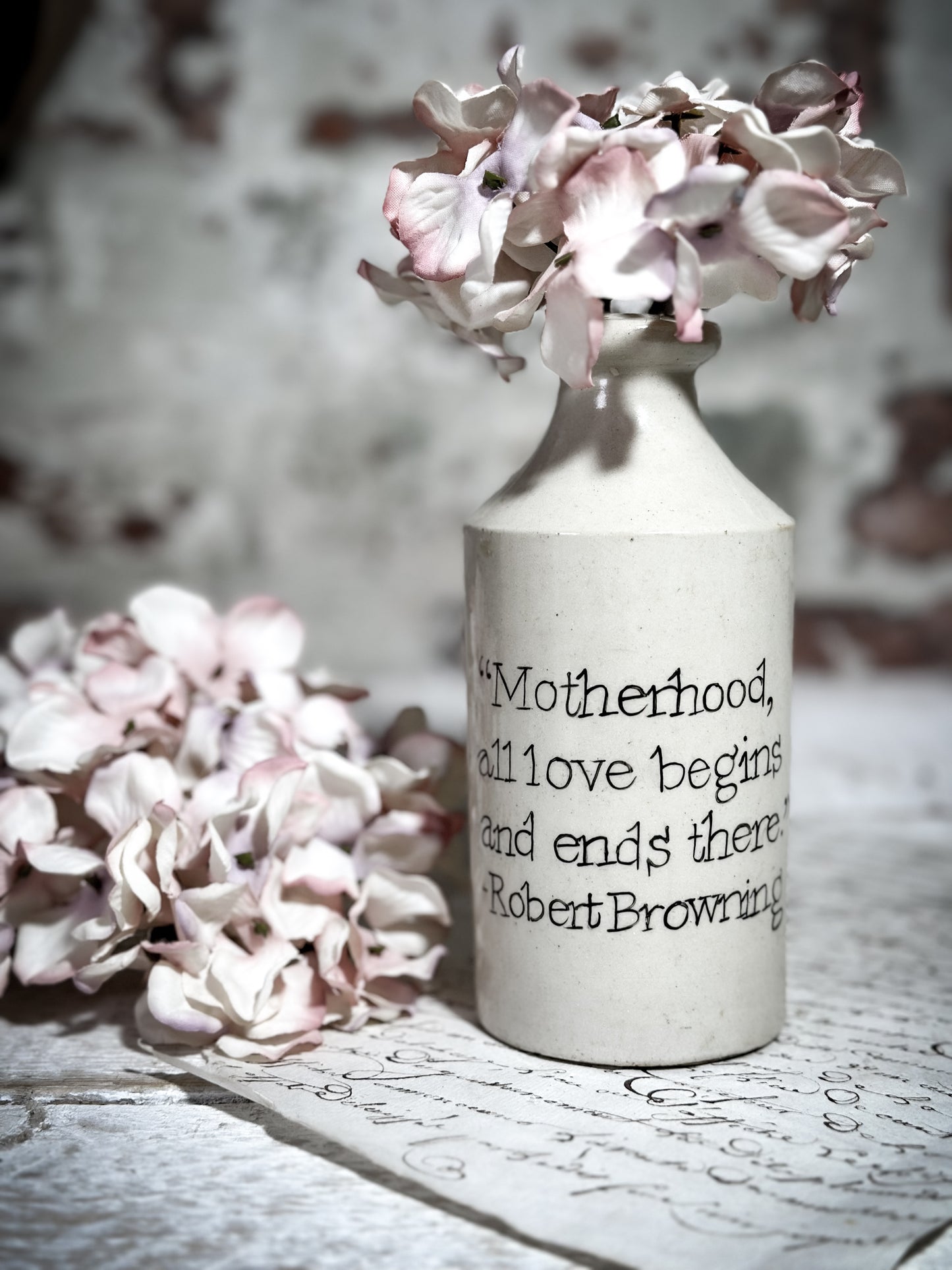 An Antique Pottery Bottle with a Hand Painted Inspirational Quote