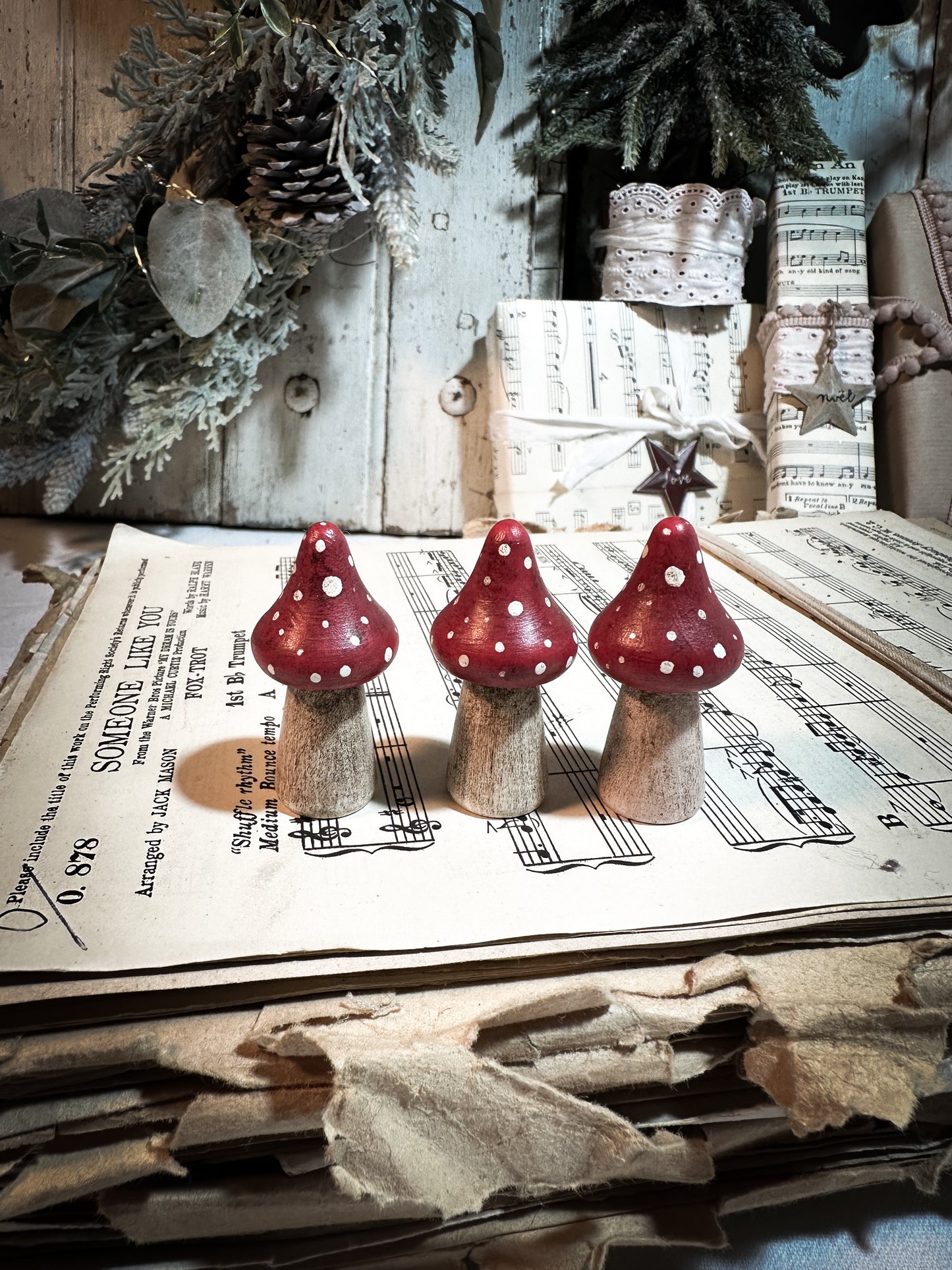 A wooden hand painted Christmas village toadstool