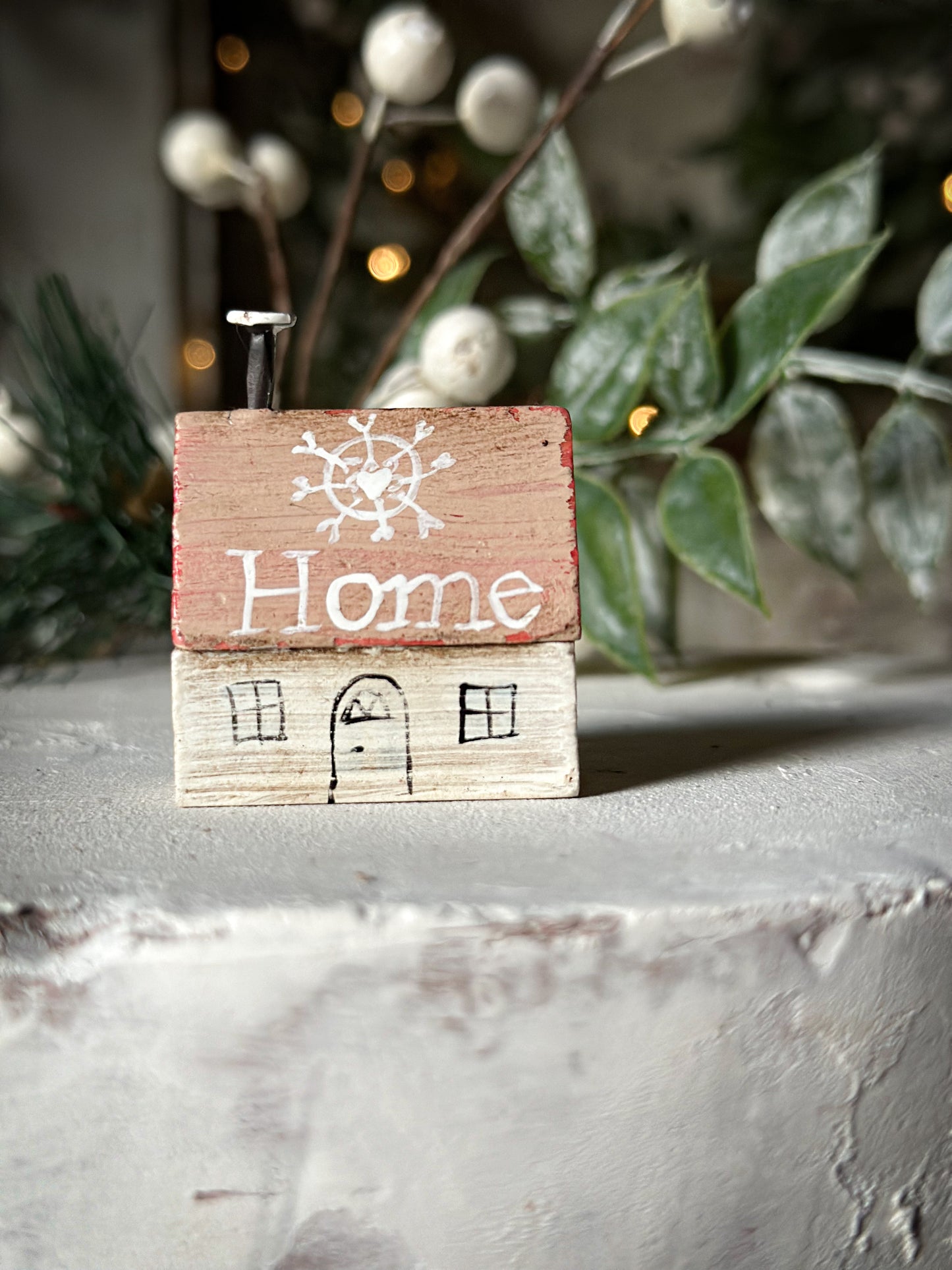 A pretty vintage German Erzgebirge Putz wooden village house painted with a Christmas quote