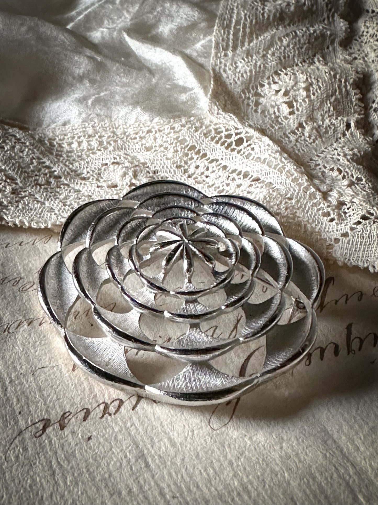 A glorious vintage Sara Coventry brushed white metal flower brooch signed