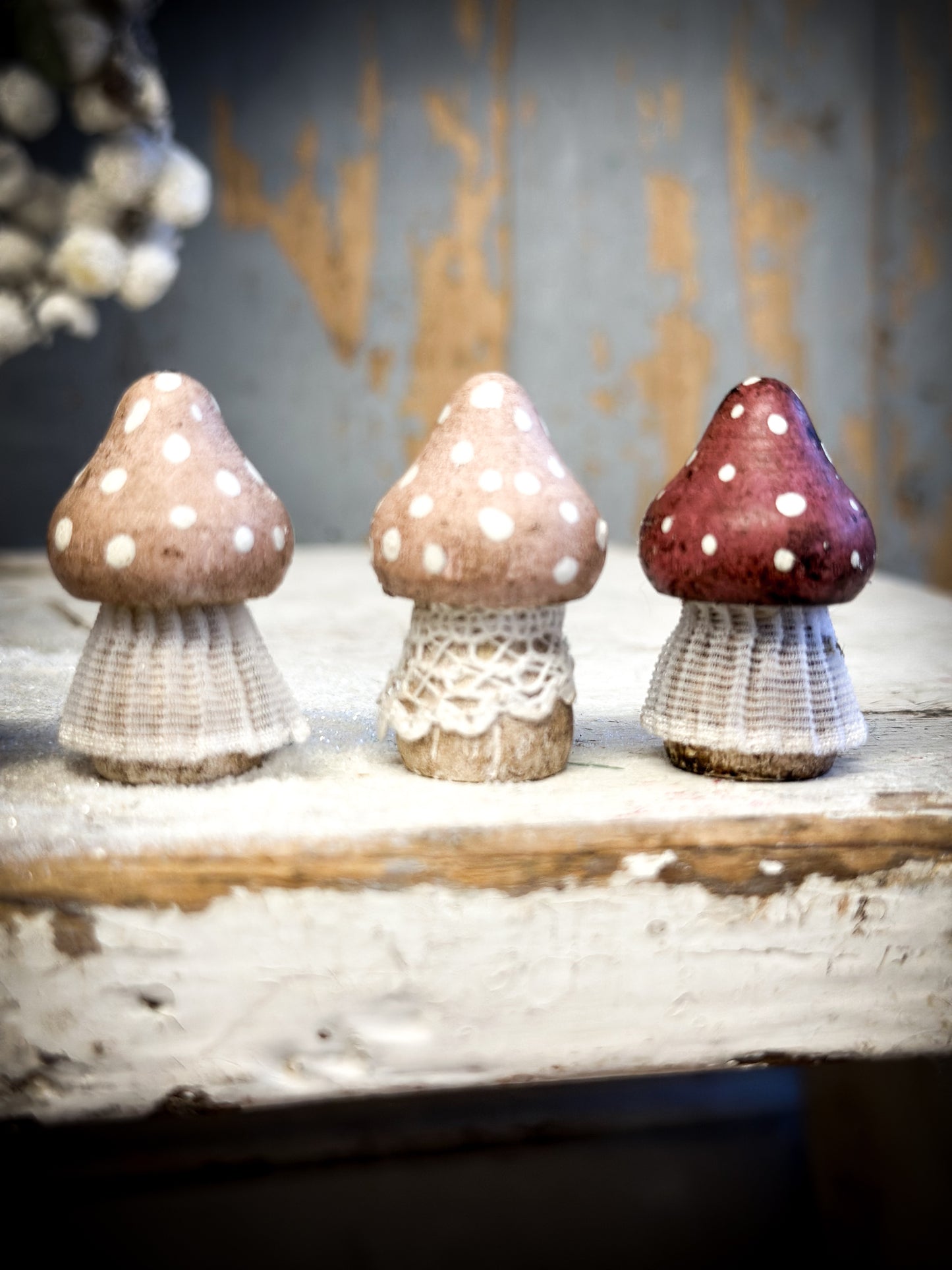 A wooden hand painted and trimmed Christmas village toadstool small pointy one