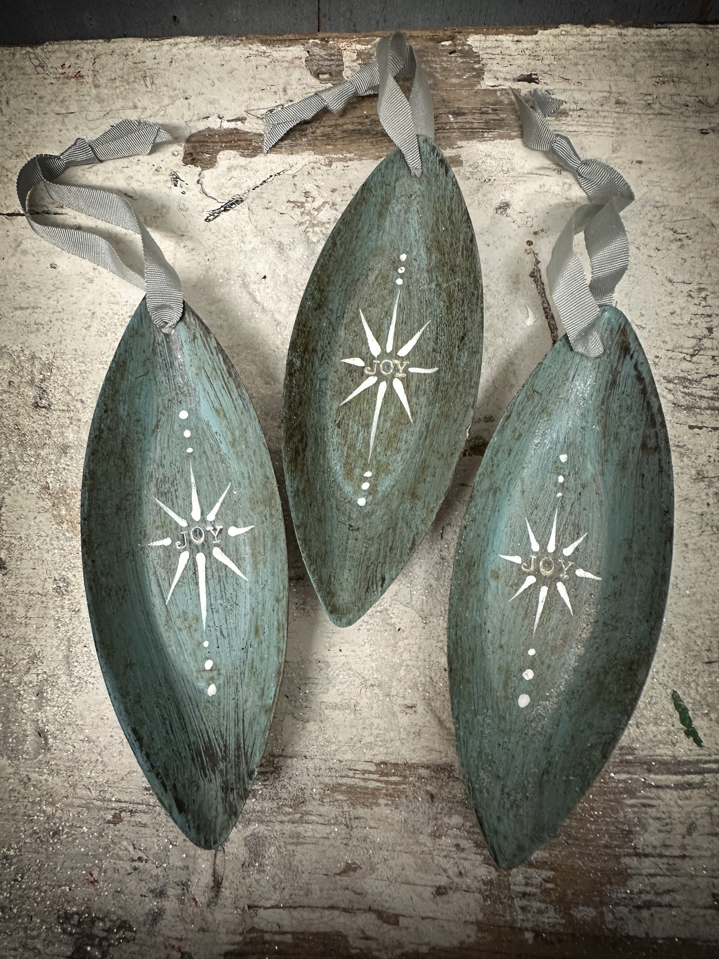 A Reworked French Patisserie Tin Christmas Decoration Stamped and Painted “Joy”