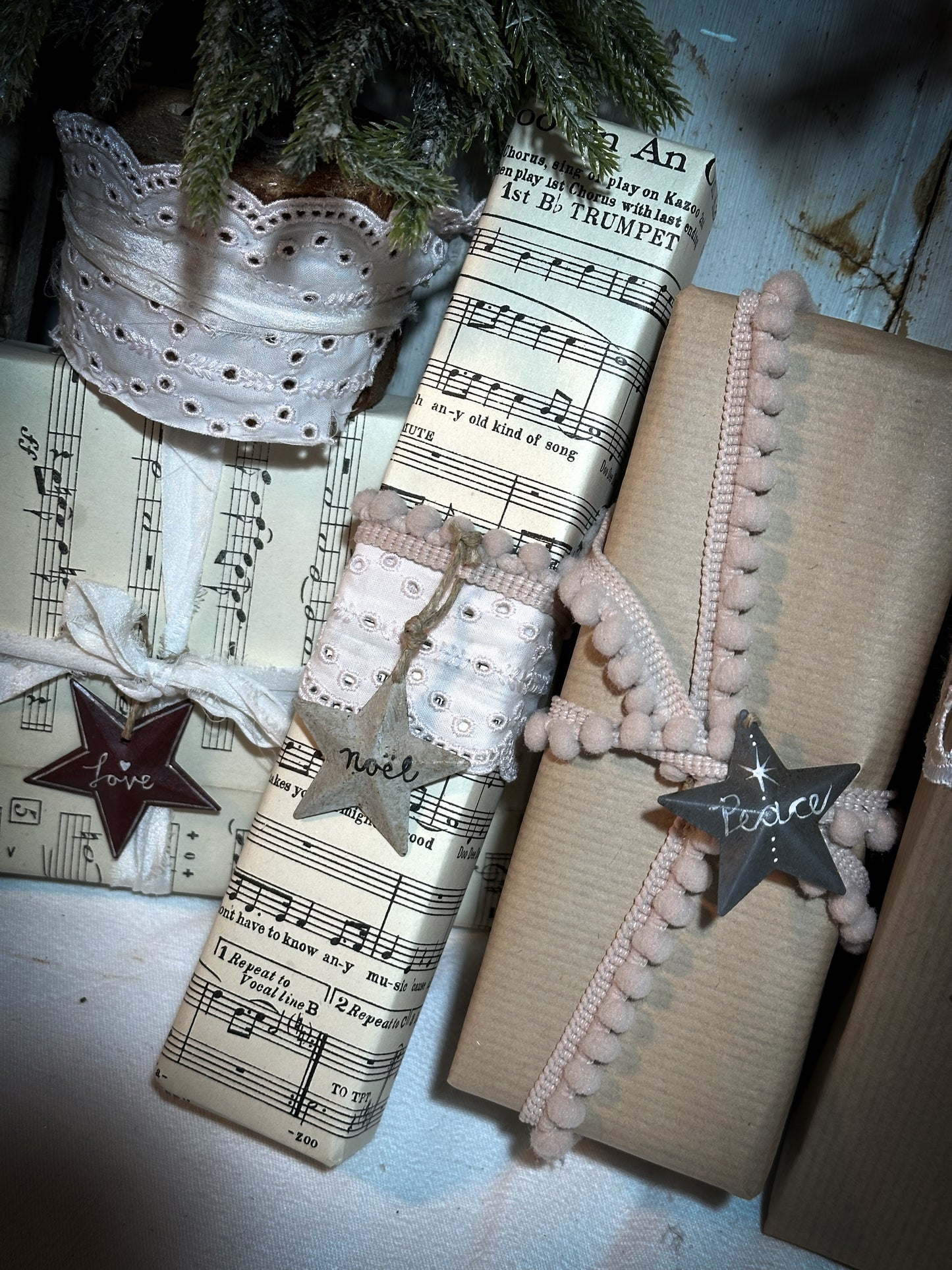 A mini tin barn star pink decoration hand painted with “Joy”