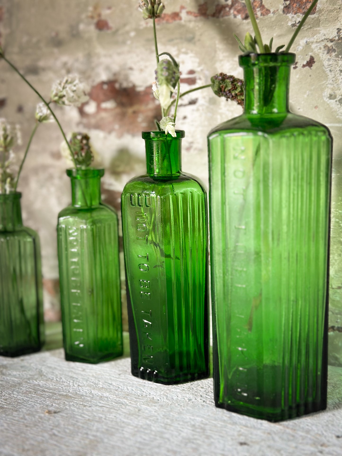 A set of Five lovely antique green poison bottles